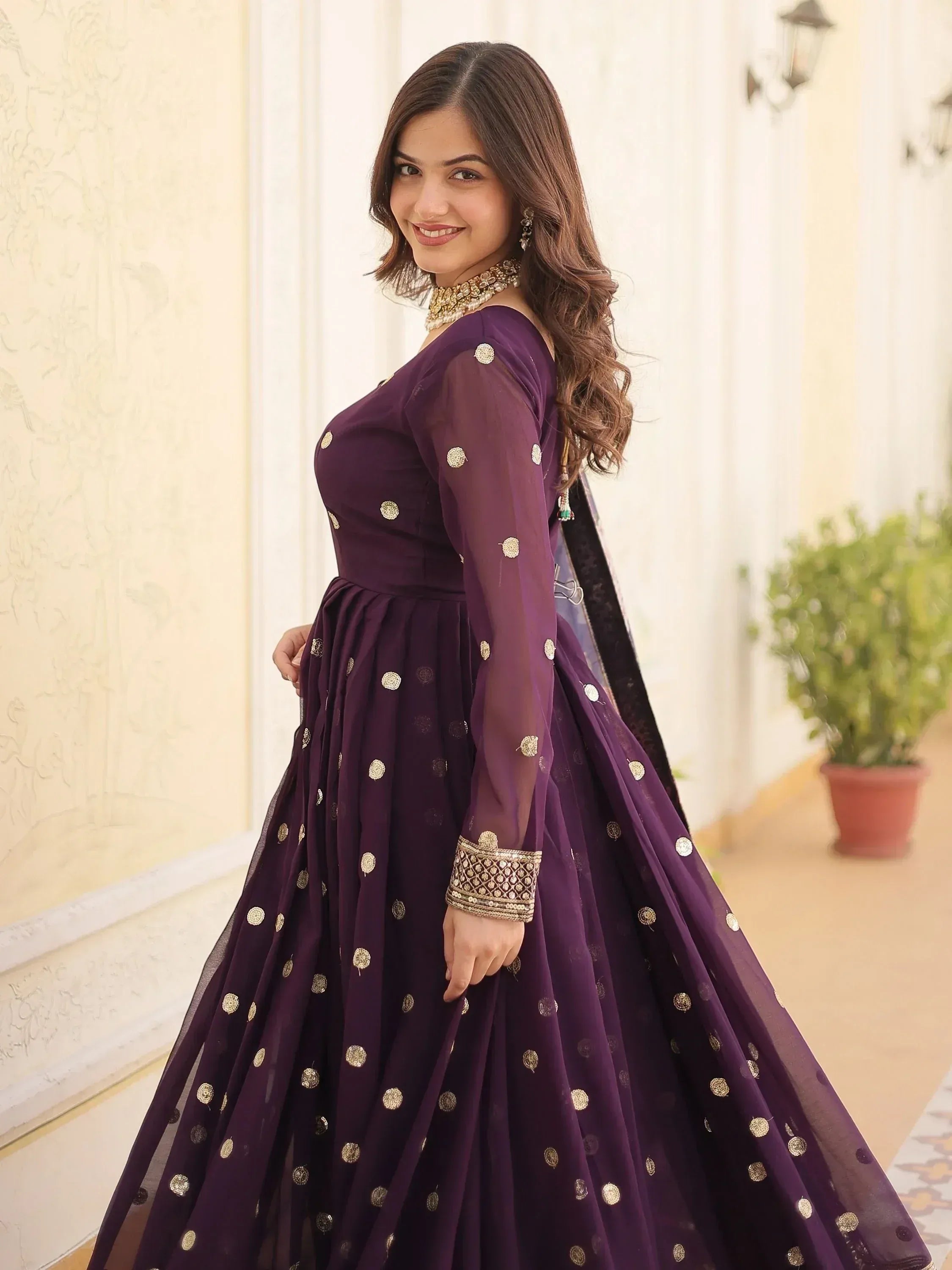 Purple designer lehenga choli with gold polka dots and sheer sleeves, perfect for Indian ethnic wear