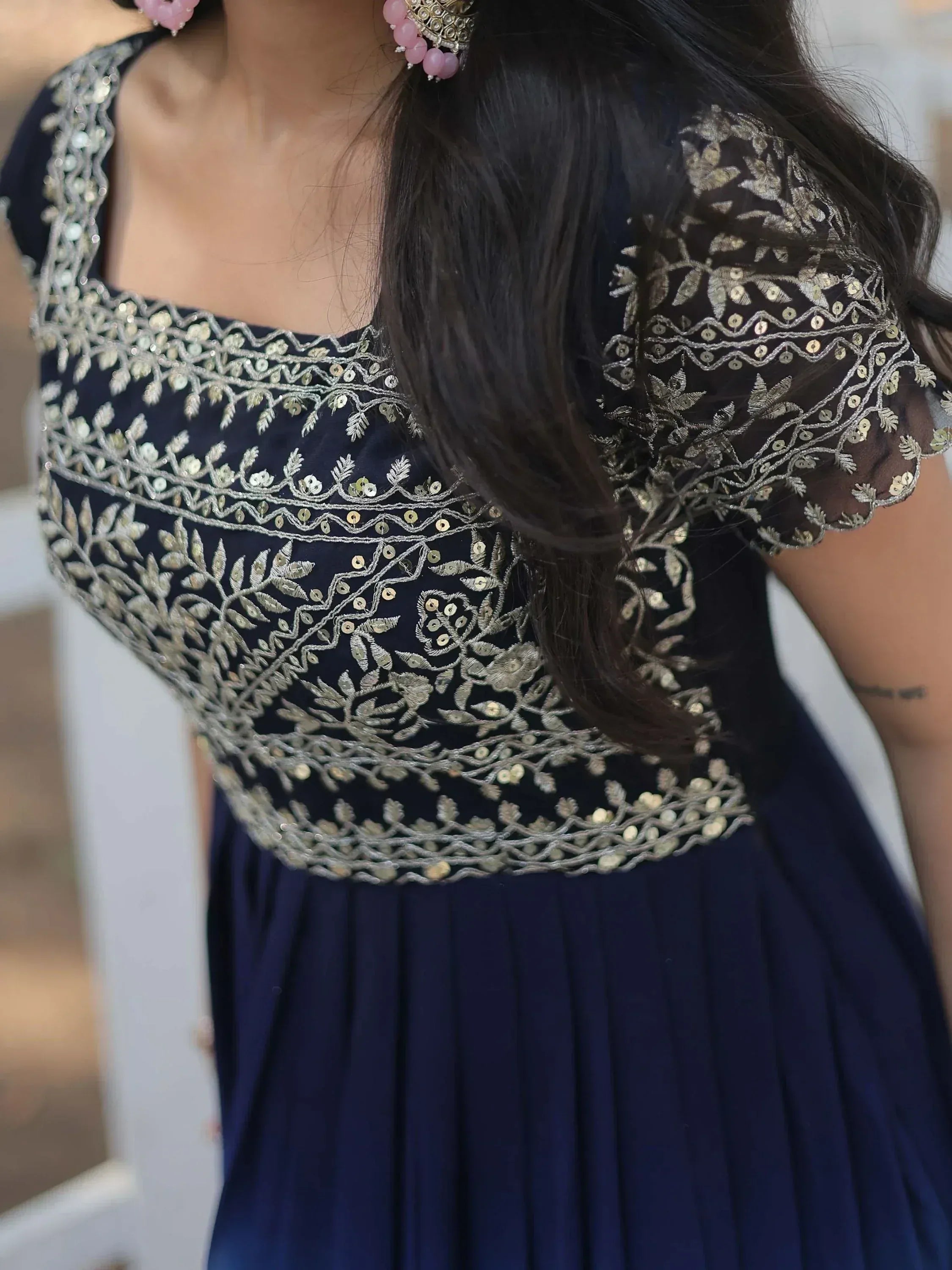 Navy blue ethnic gown with silver floral embroidery and sequins, perfect for Indian occasions.