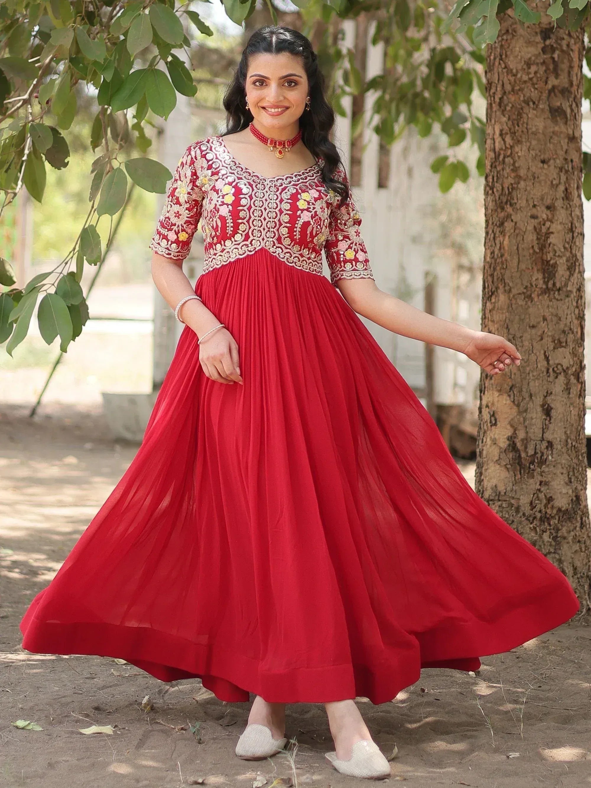 Red embroidered ethnic gown with floral detailing, perfect for Indian occasions and festive wear.