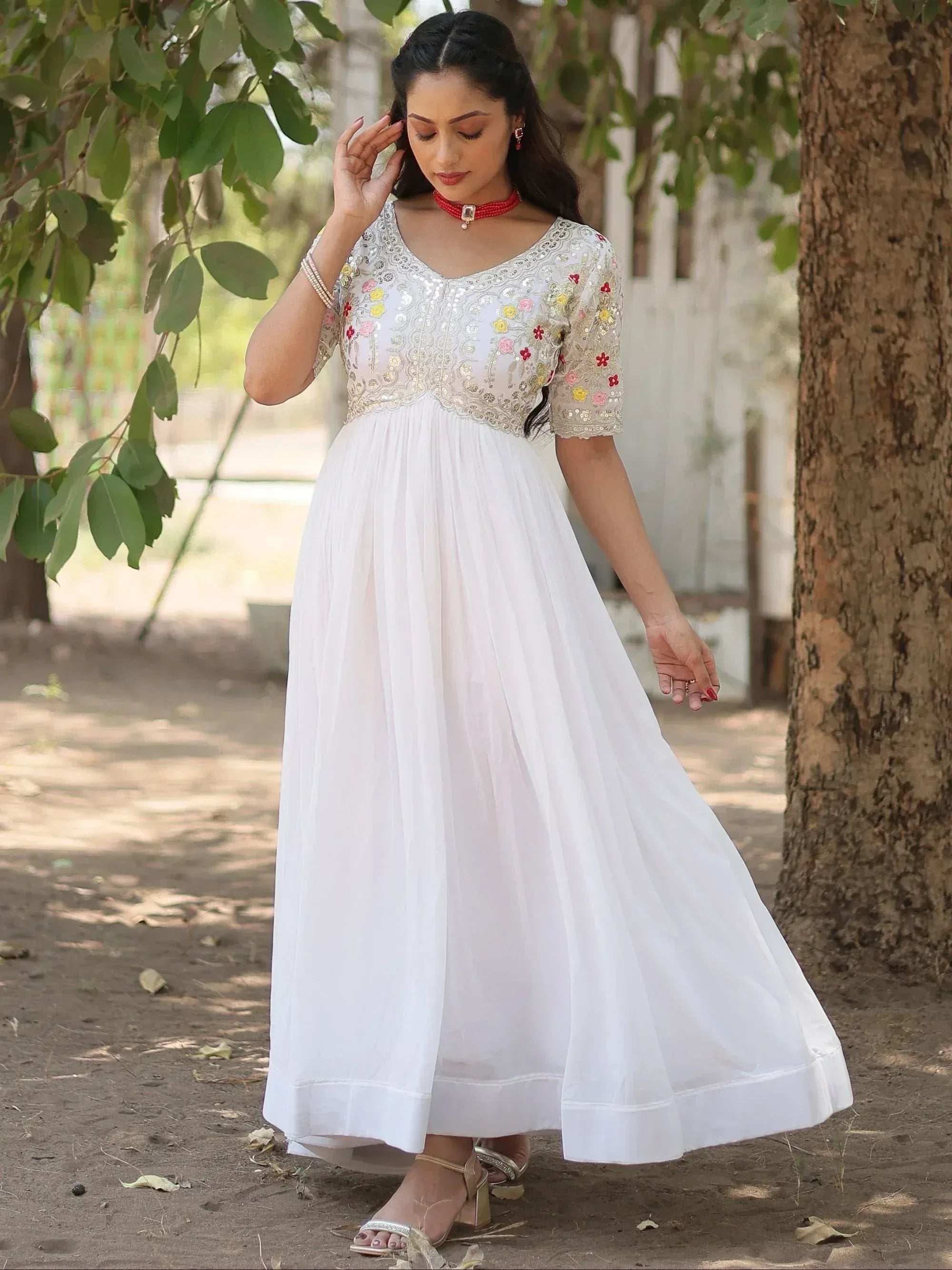 White ethnic gown with floral embroidery, perfect for Indian occasions and festive wear.
