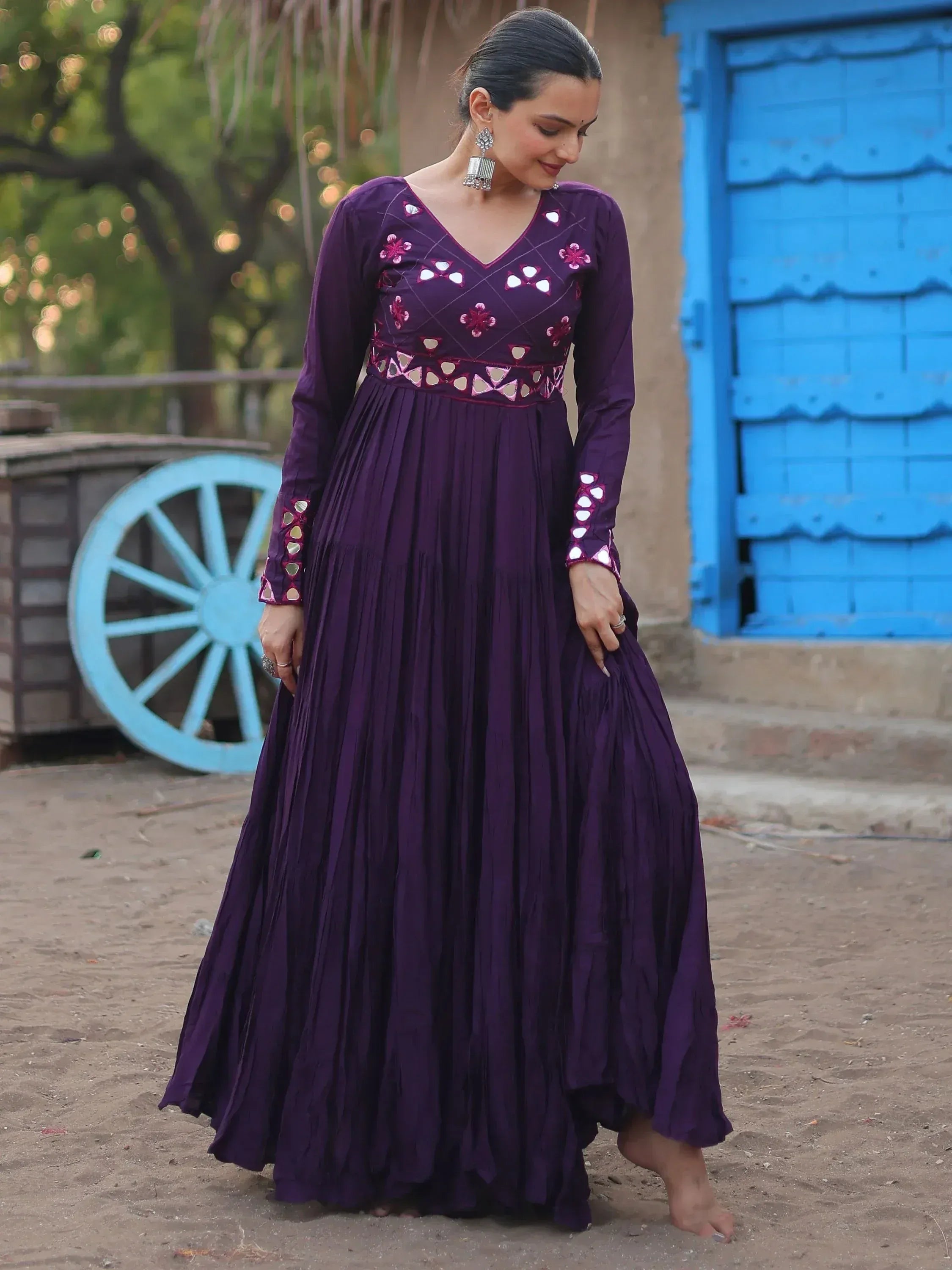 Purple ethnic gown with mirror work and floral embroidery, perfect for Indian occasions