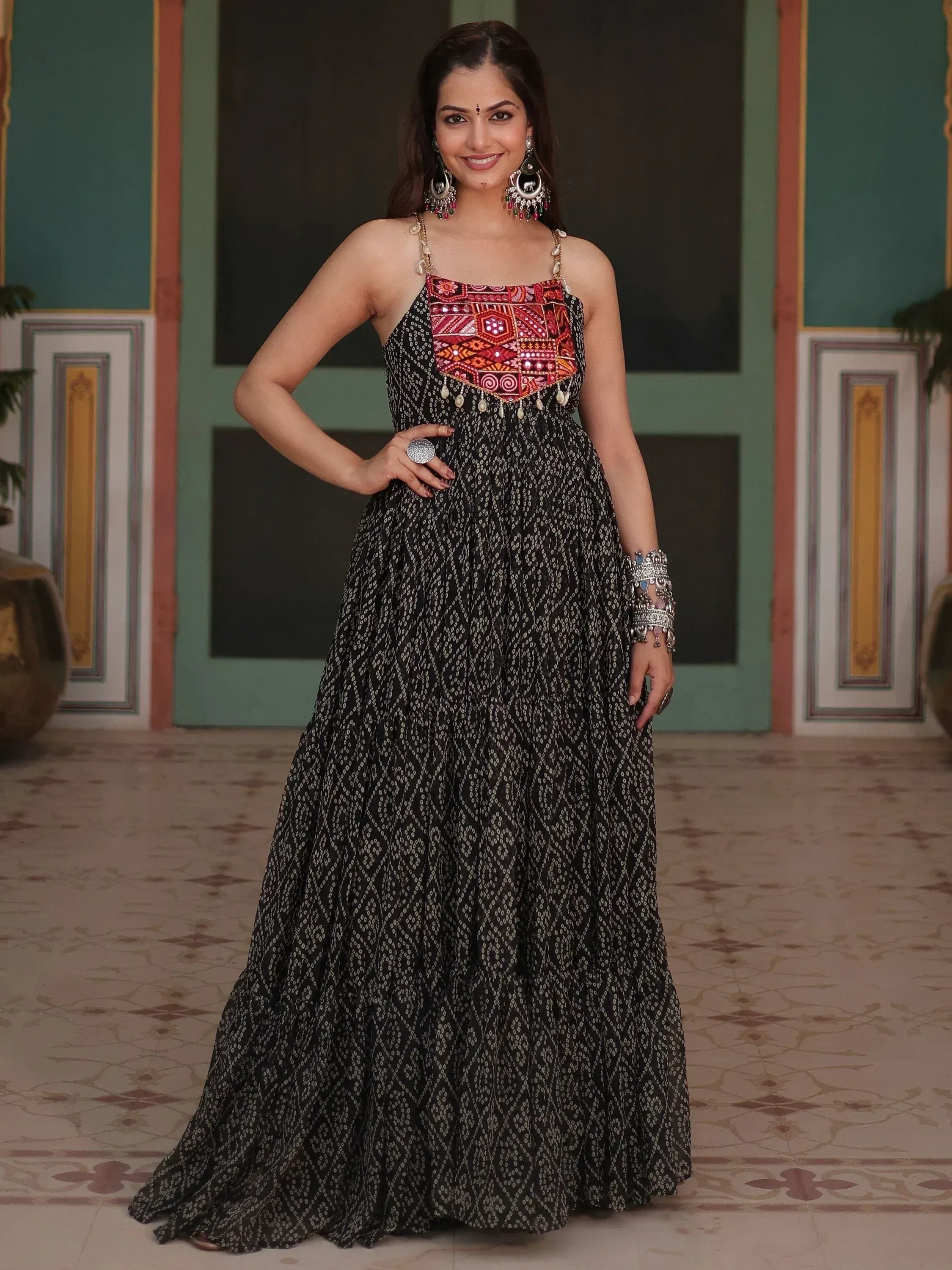 Woman in black ethnic gown with red embroidered bodice, perfect for Indian festive occasions