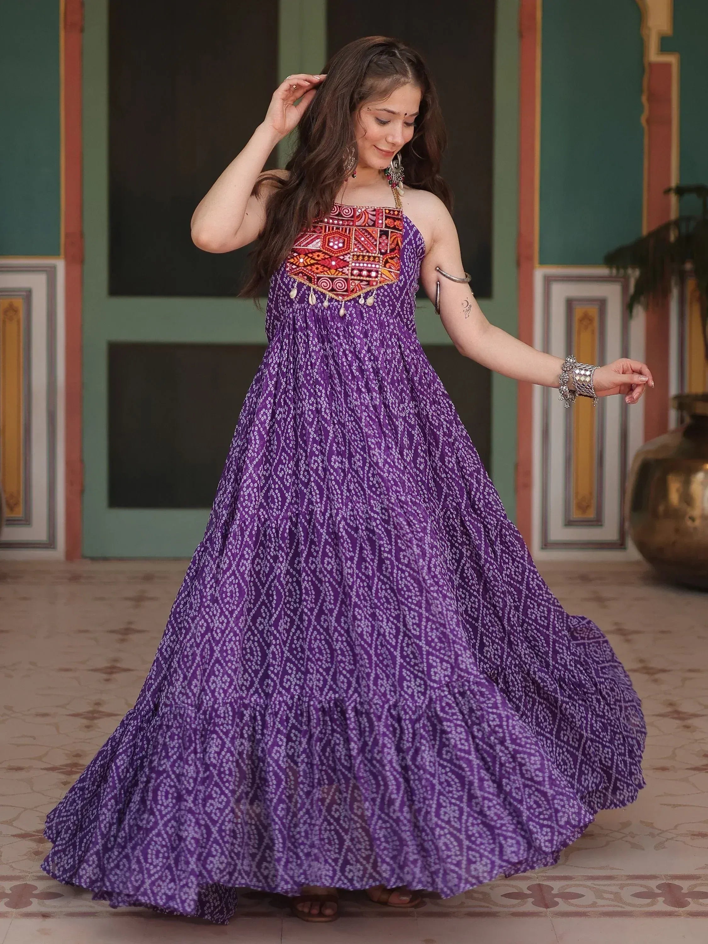 Purple ethnic gown with embroidered bodice and printed skirt, perfect for Indian festive occasions