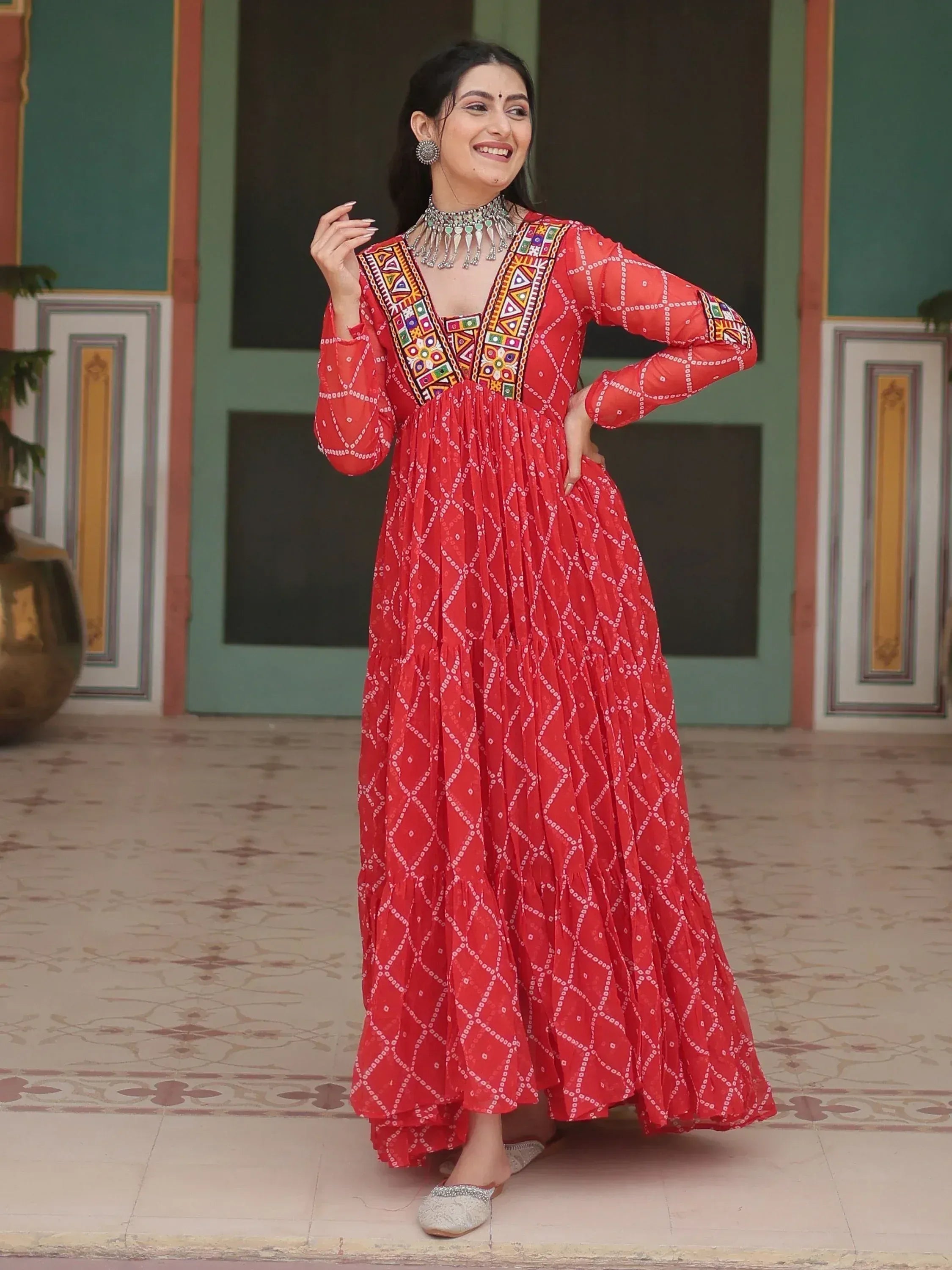 Red ethnic gown with mirror work and geometric print, perfect for Indian festive occasions