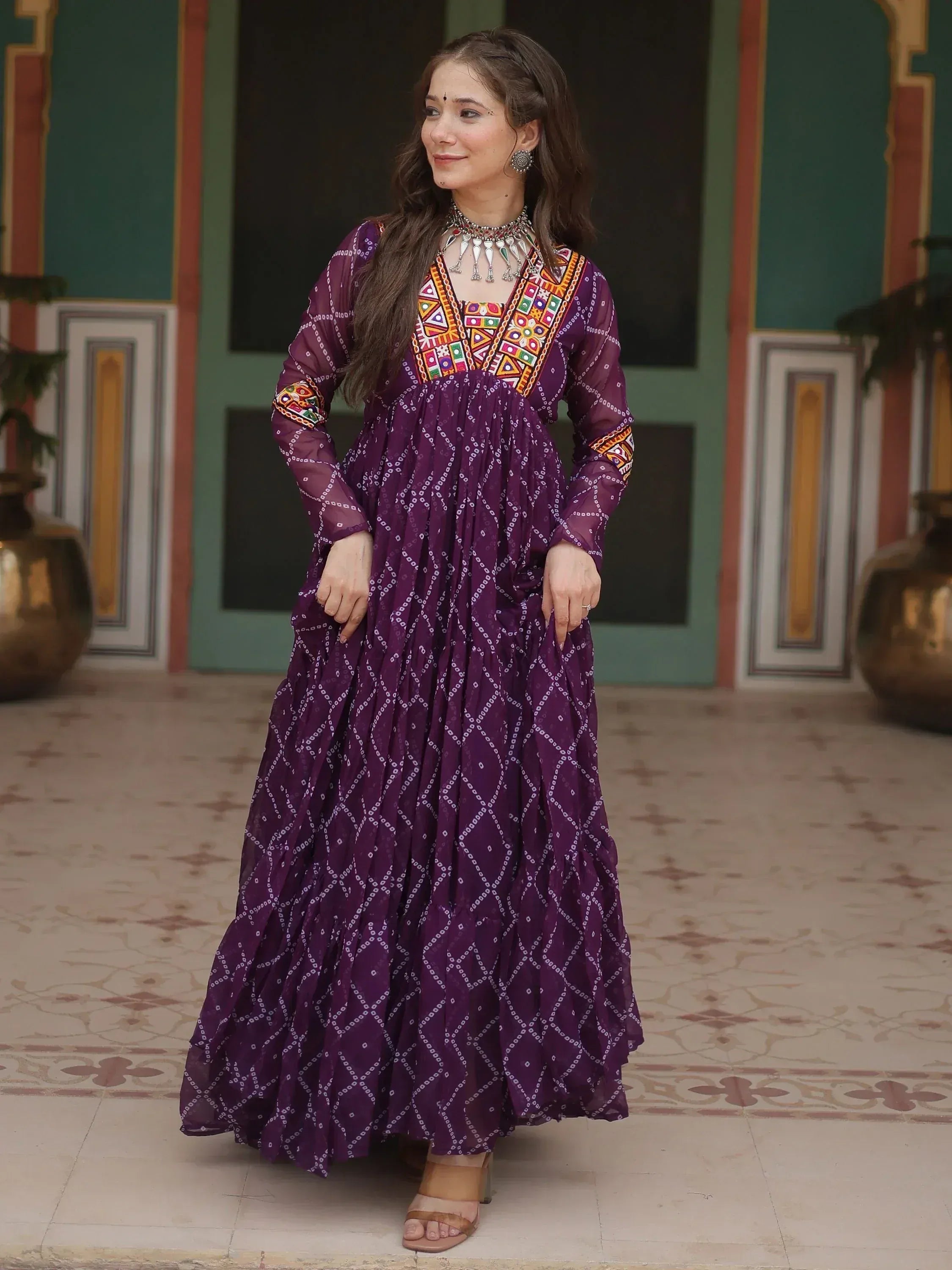Purple ethnic gown with colorful embroidery, perfect for Indian festive occasions and traditional events.