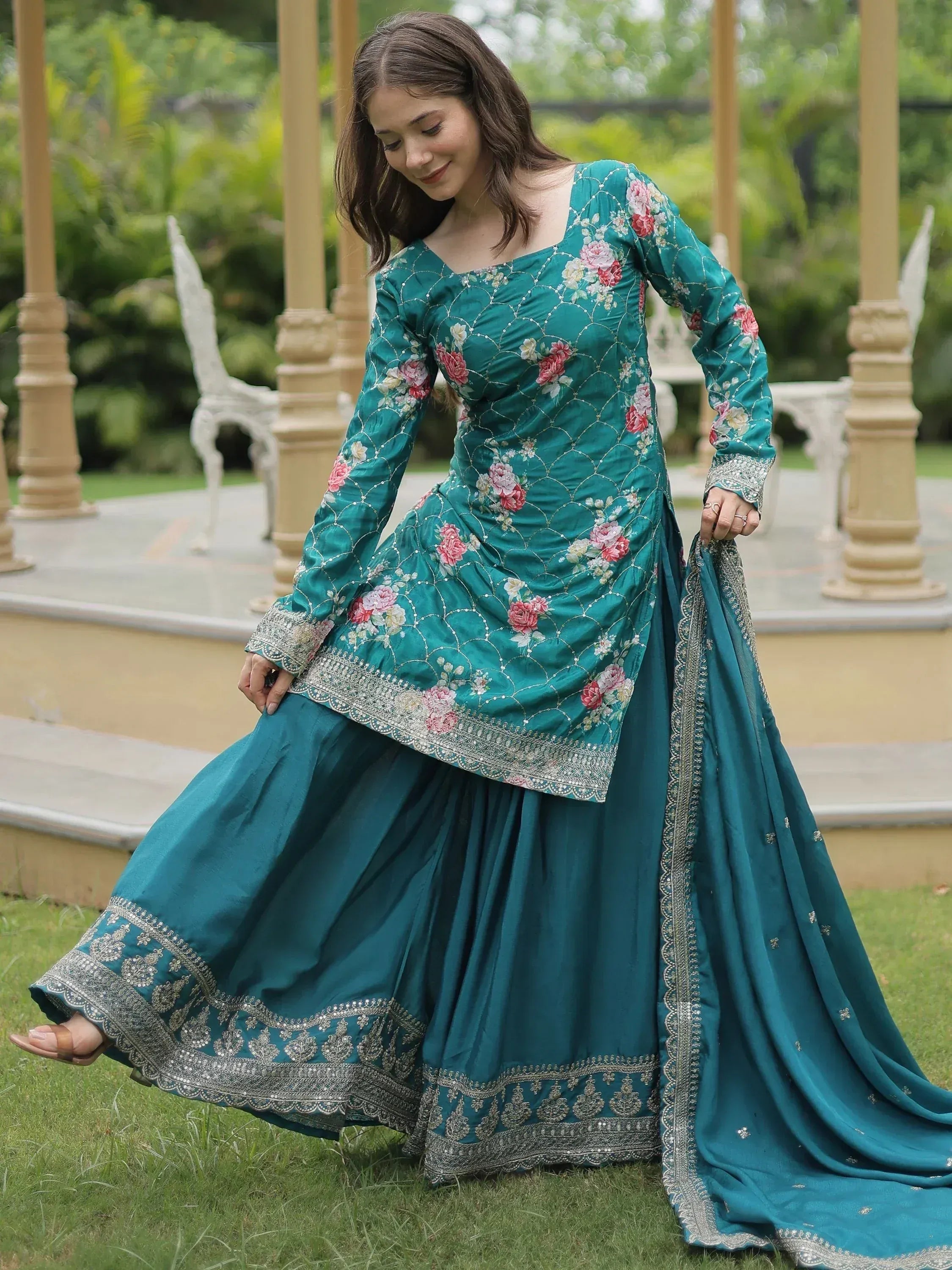 Teal floral embroidered Indian ethnic gown with silver detailing, perfect for festive occasions