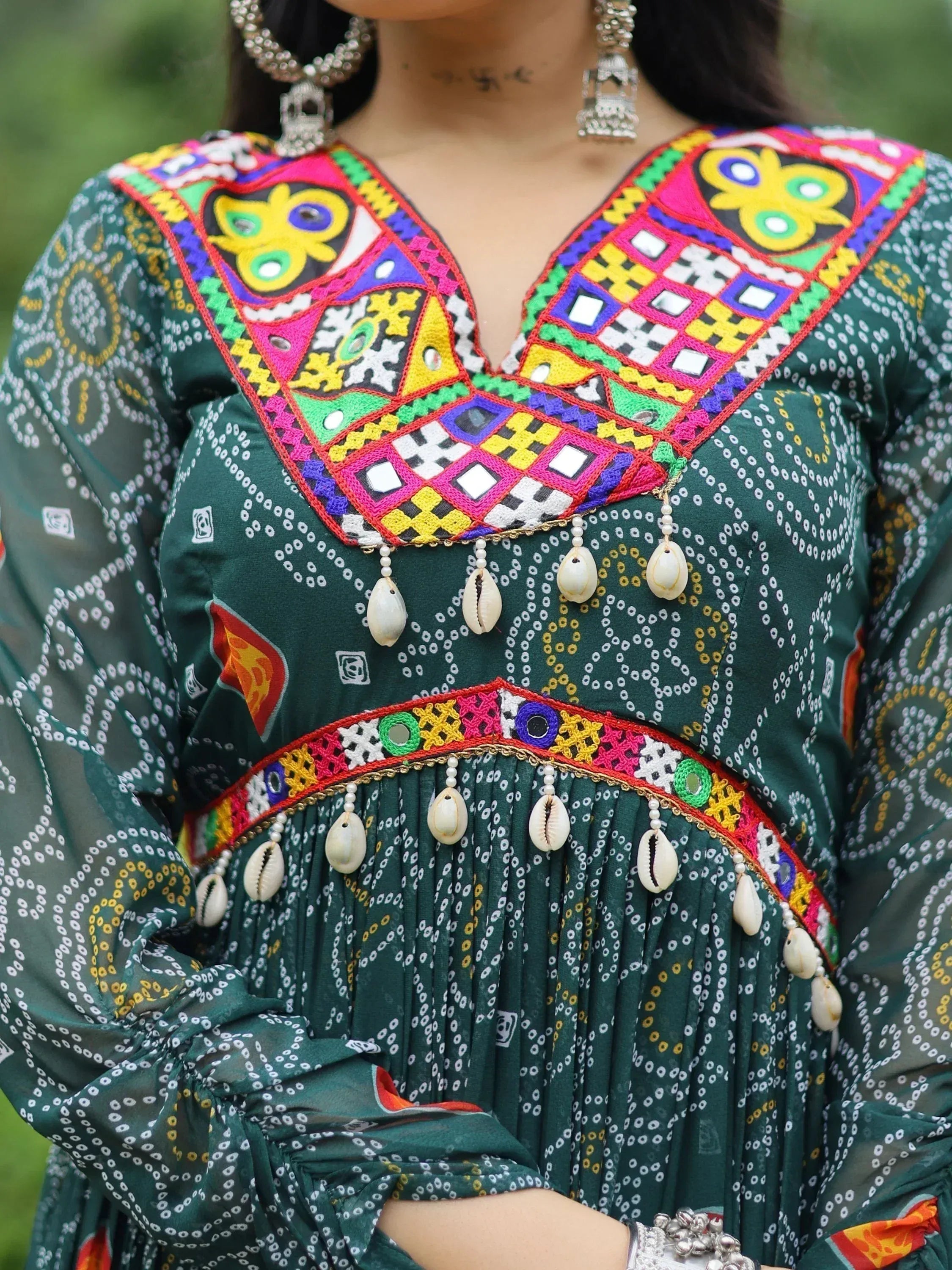 Green ethnic dress with colorful mirror embroidery and shell embellishments