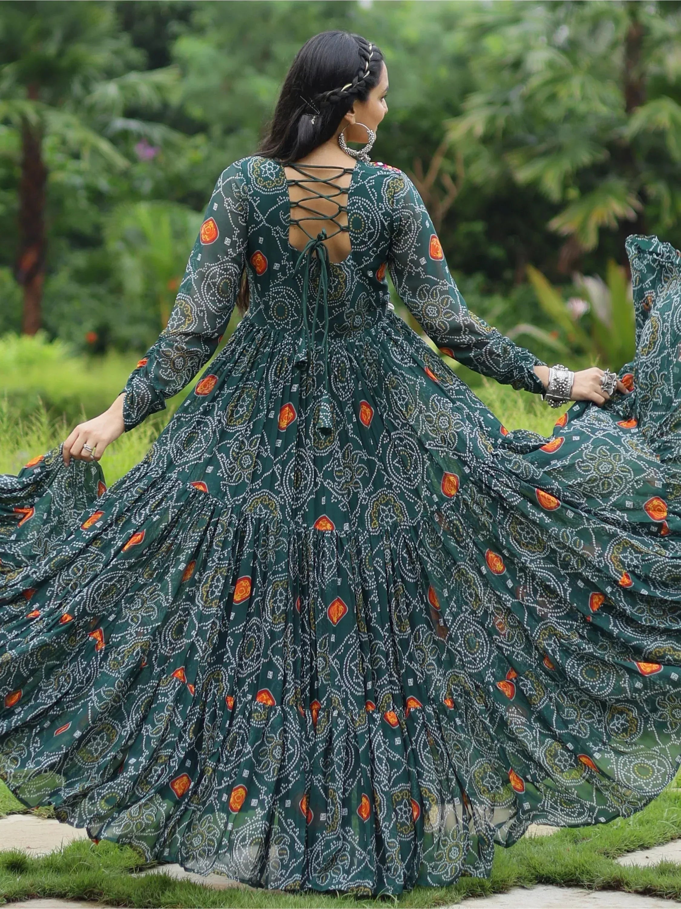 Elegant green printed ethnic gown with lace-up back, perfect for festive occasions