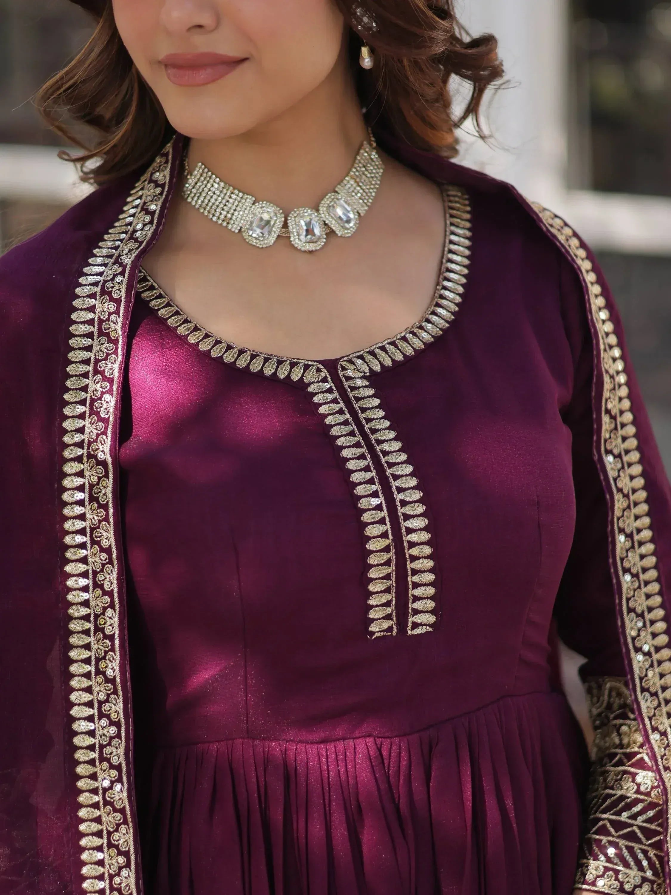 Elegant purple ethnic gown with gold embroidery and statement necklace