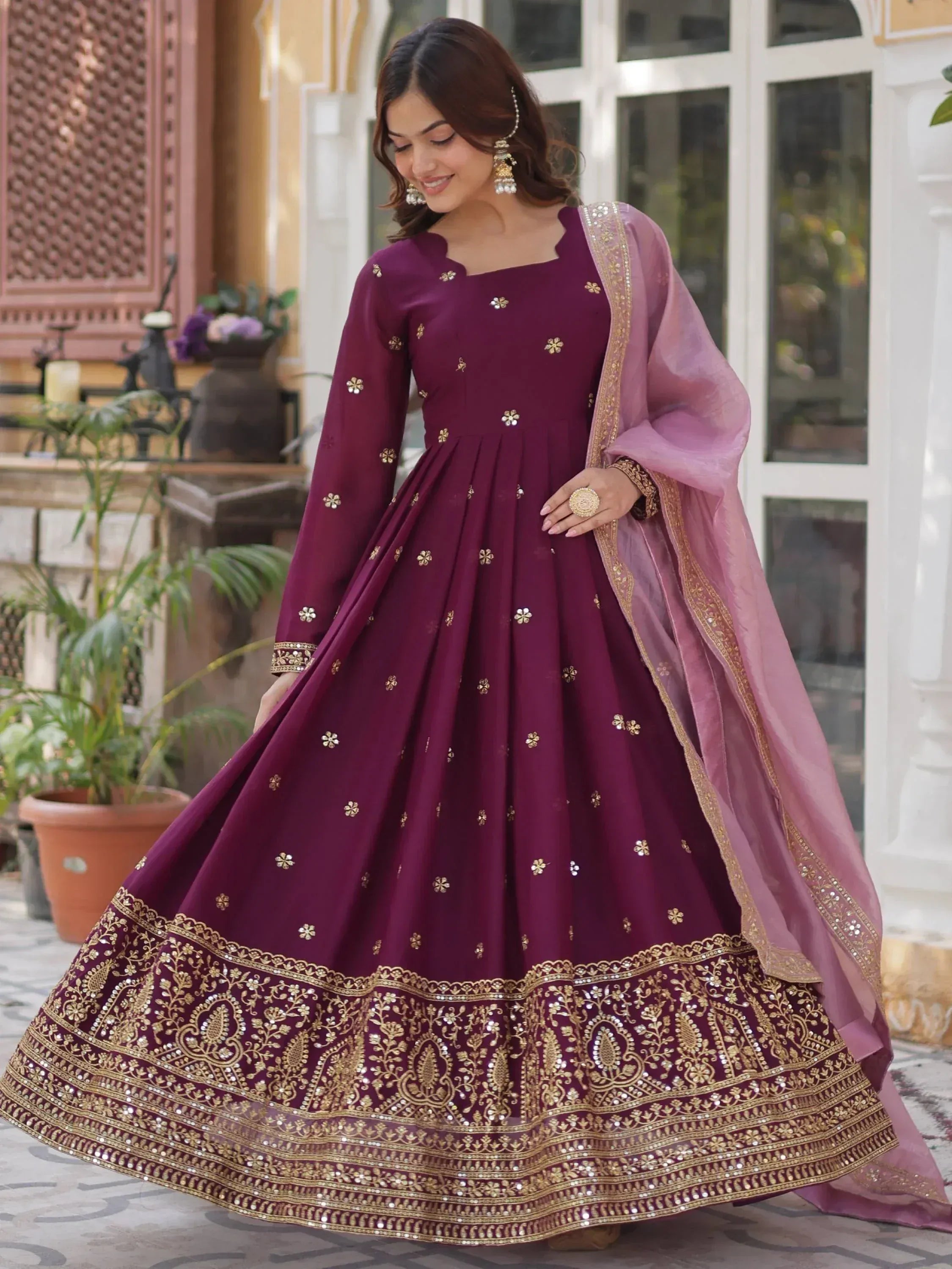Elegant maroon designer lehenga with gold embroidery and pink dupatta for Indian ethnic wear