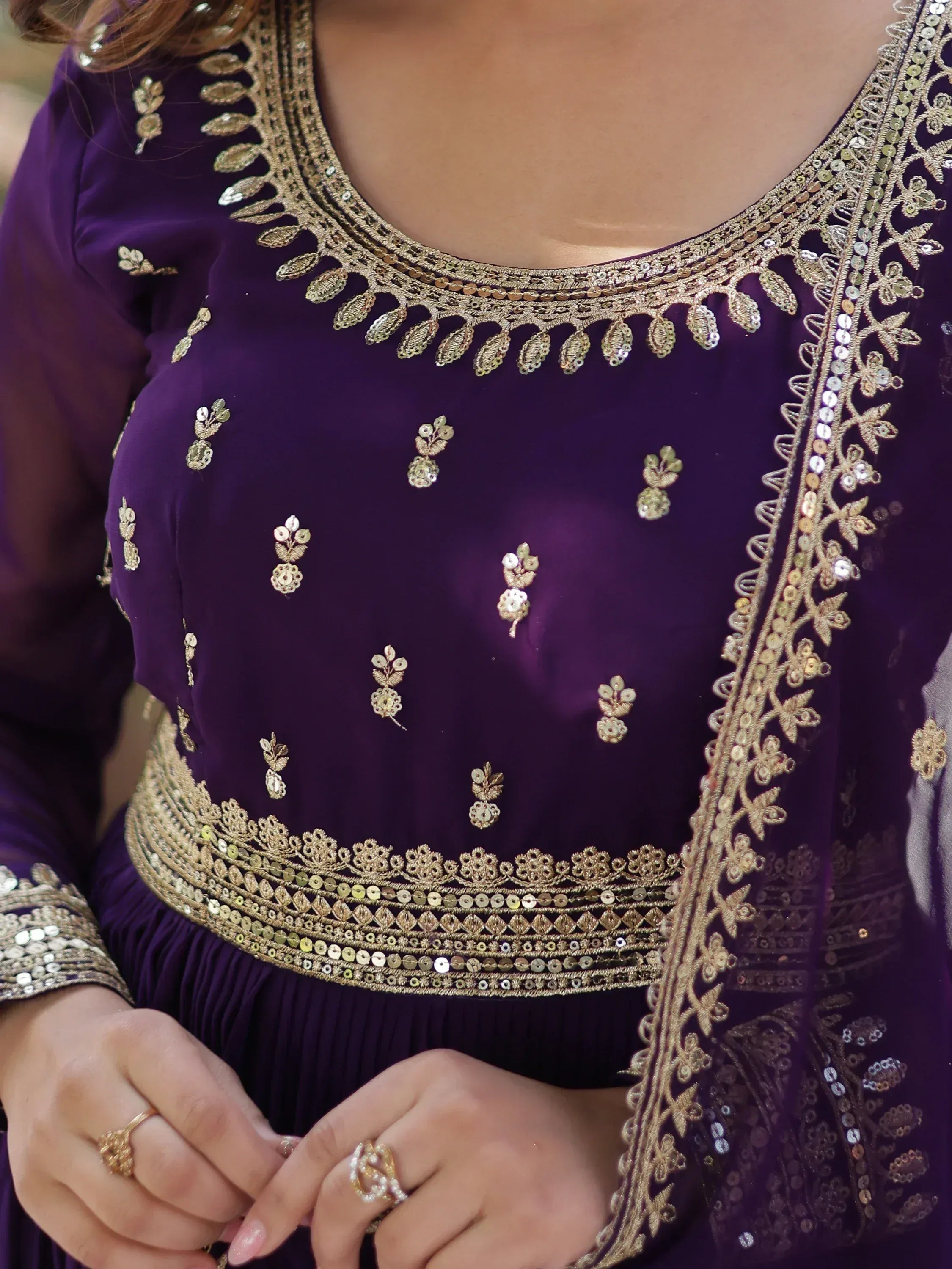 Purple ethnic gown with gold embroidery and sequin detailing, perfect for Indian festive wear
