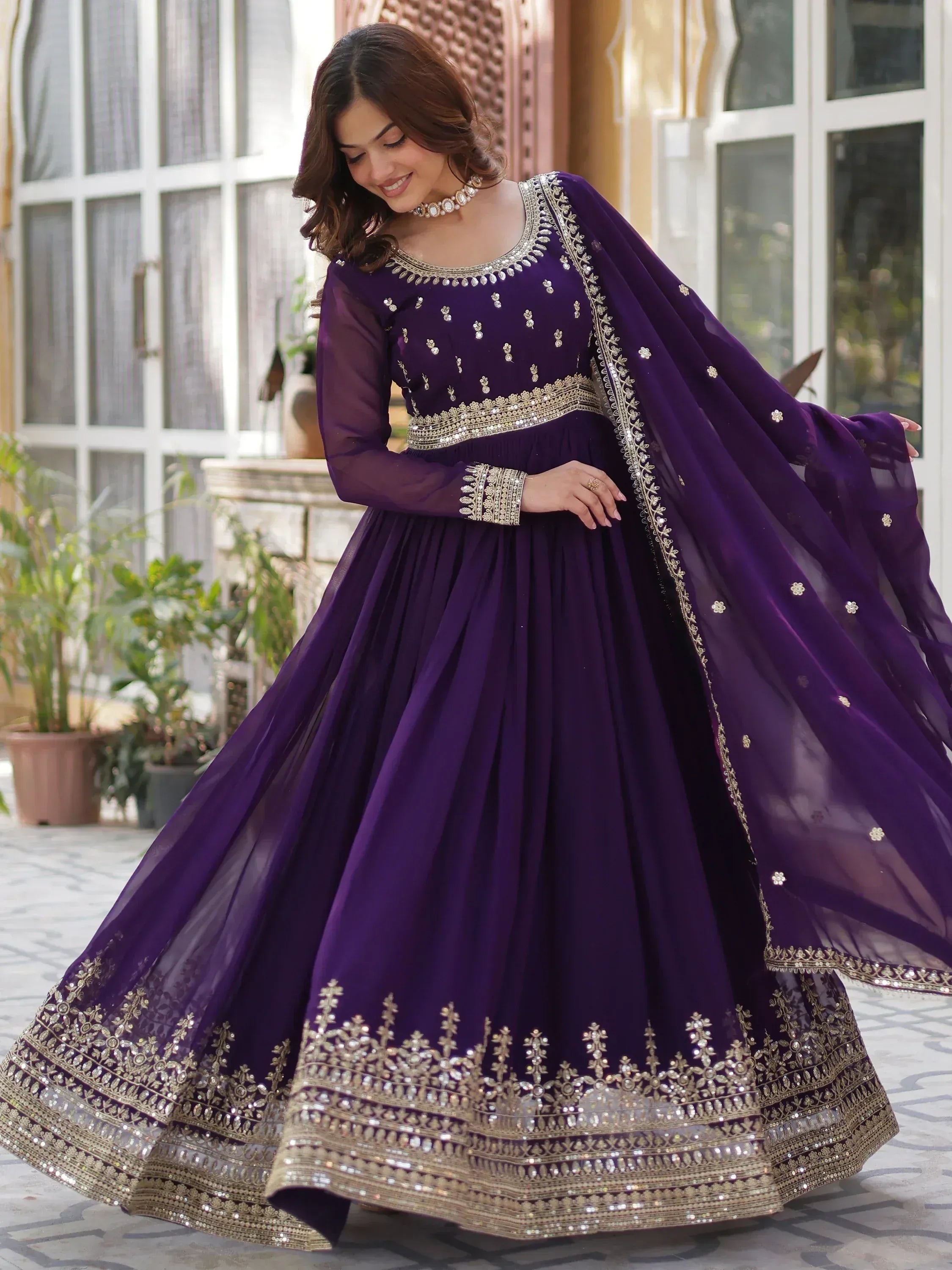 Elegant purple designer lehenga choli with gold embroidery and sheer dupatta for Indian ethnic wear