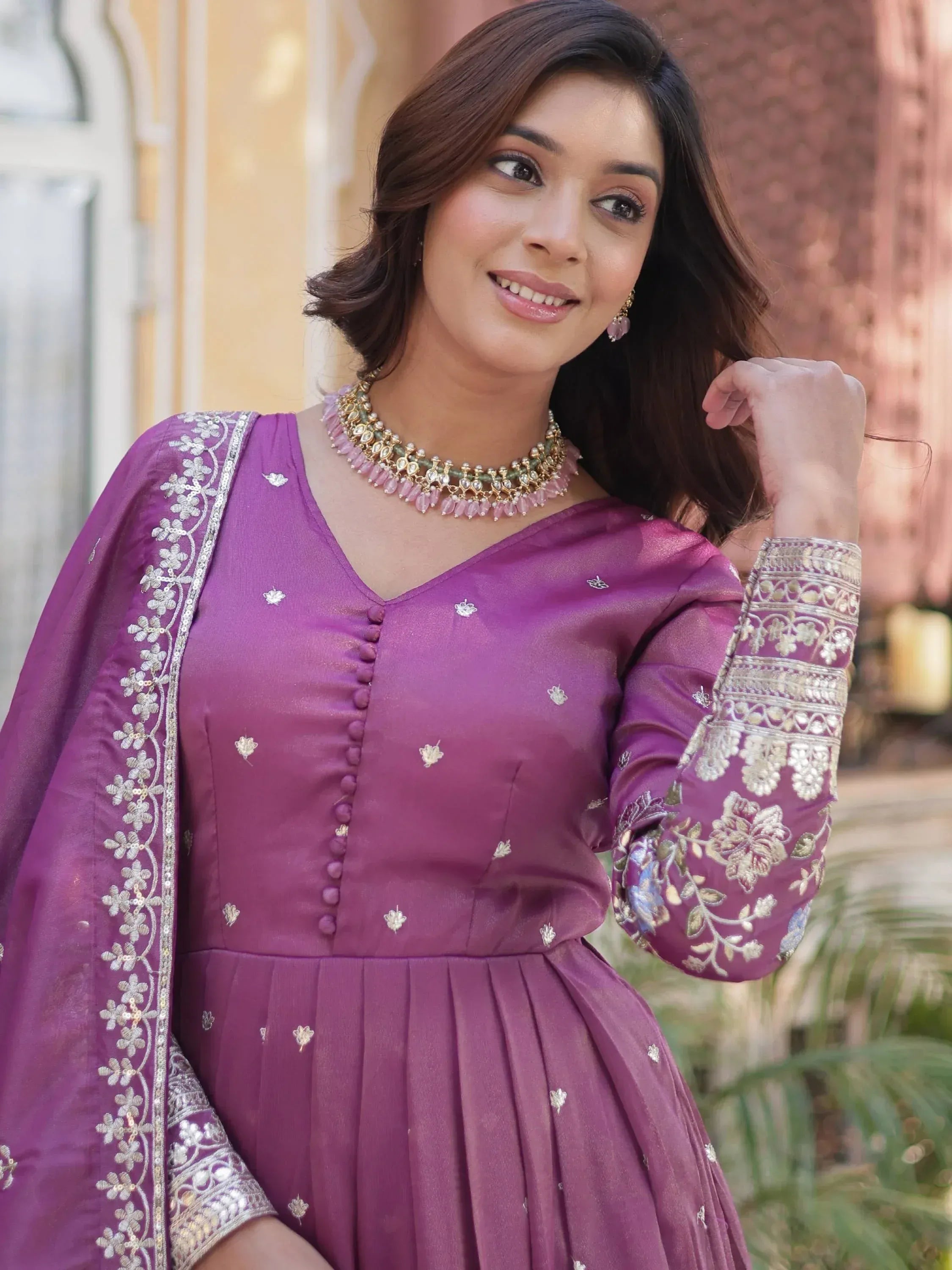 Purple embroidered ethnic gown with floral detailing and gold embellishments for women