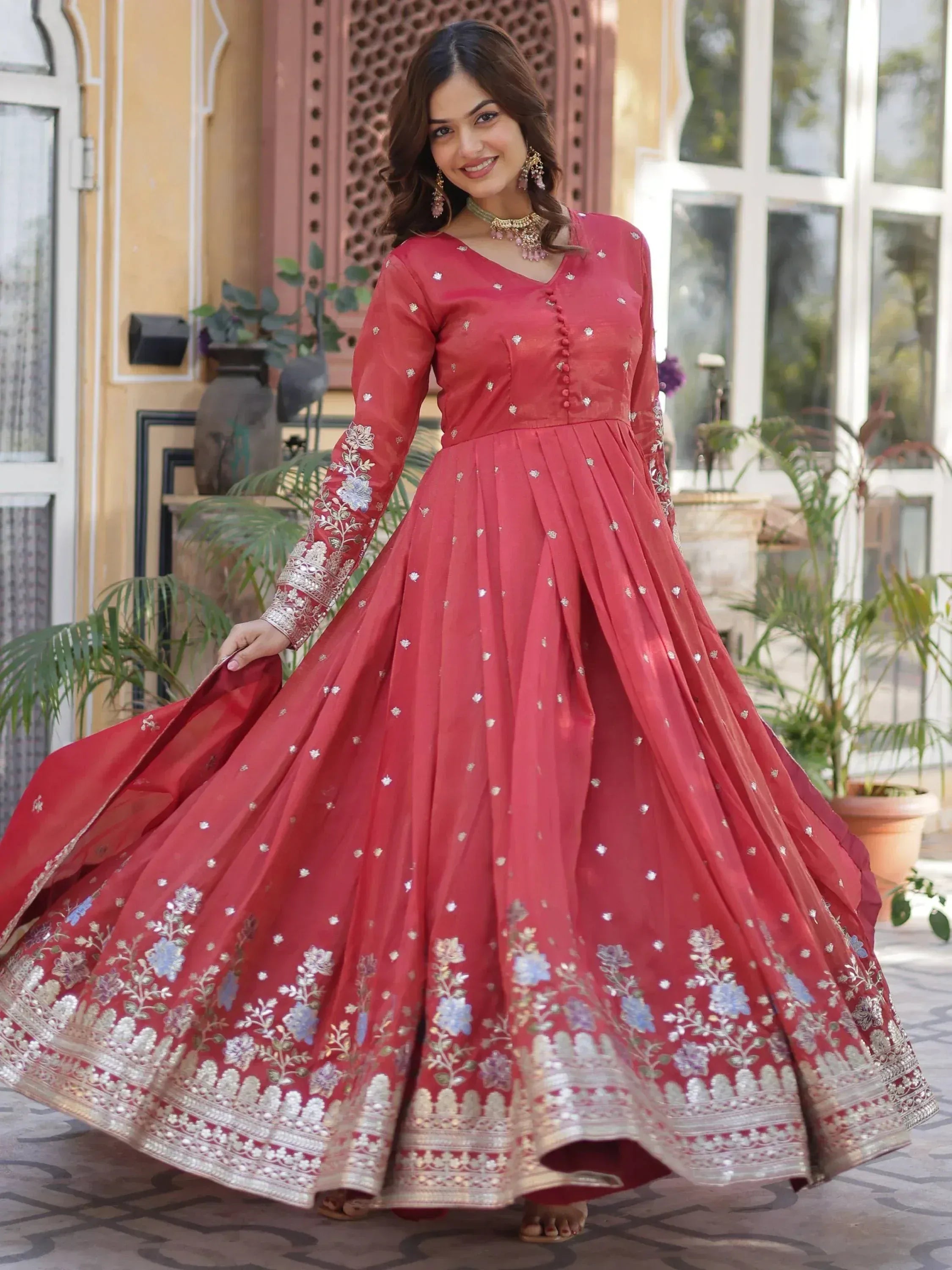Red embroidered anarkali gown with floral motifs, perfect for Indian ethnic wear and festive occasions.