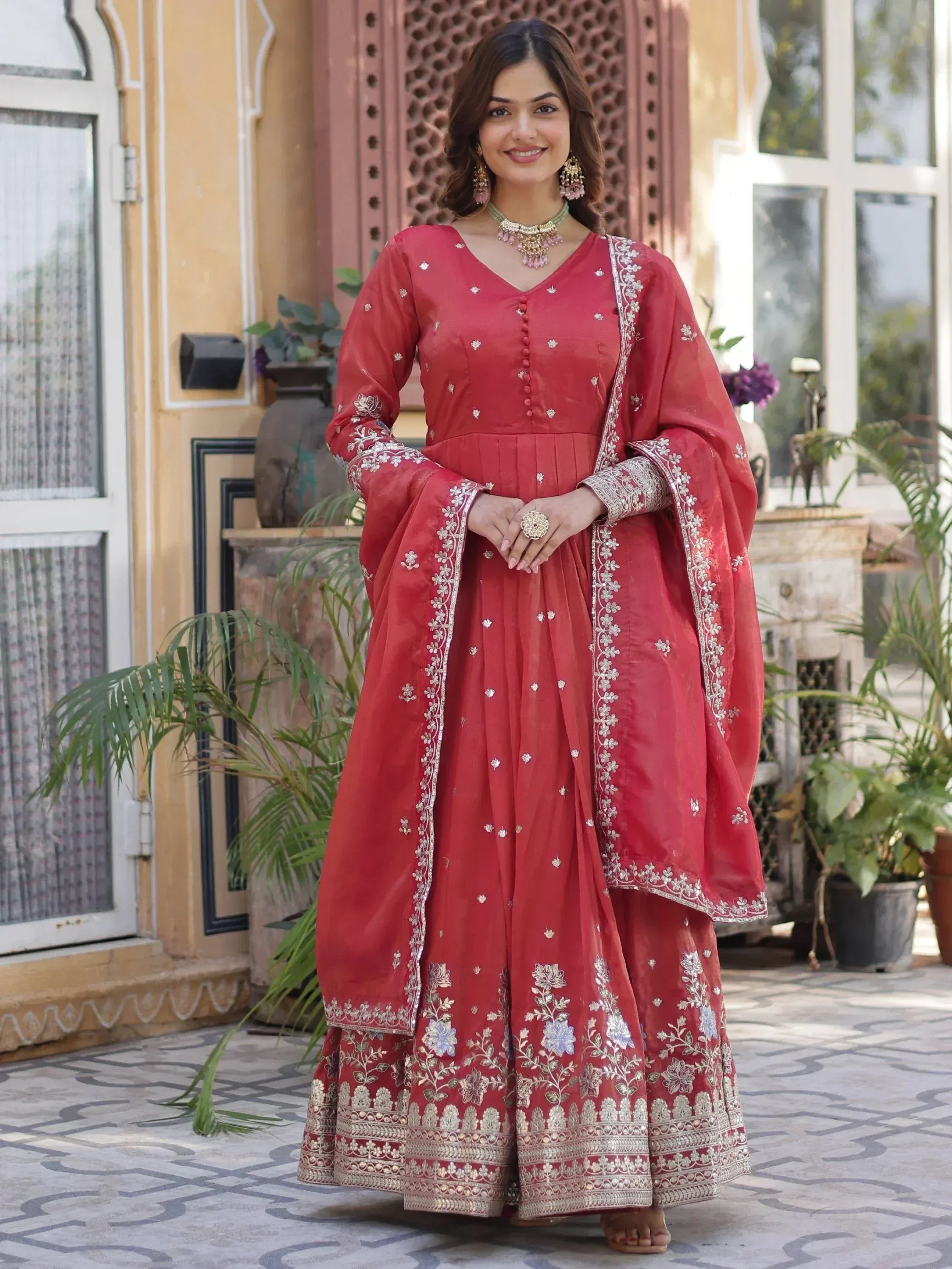 Red embroidered anarkali suit with floral motifs, perfect for Indian ethnic wear and festive occasions.
