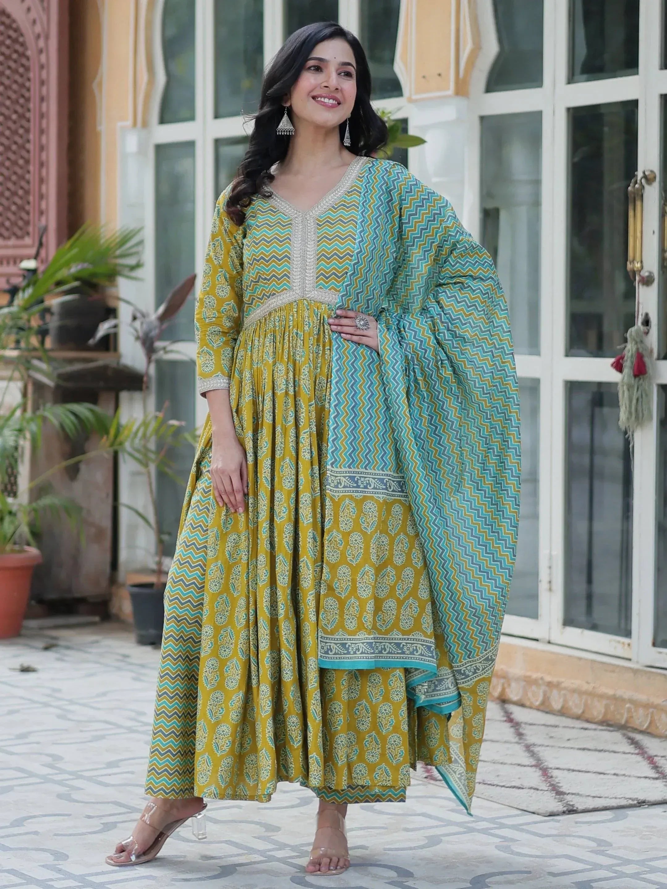 Yellow and teal printed ethnic anarkali suit with zigzag dupatta, perfect for Indian occasions