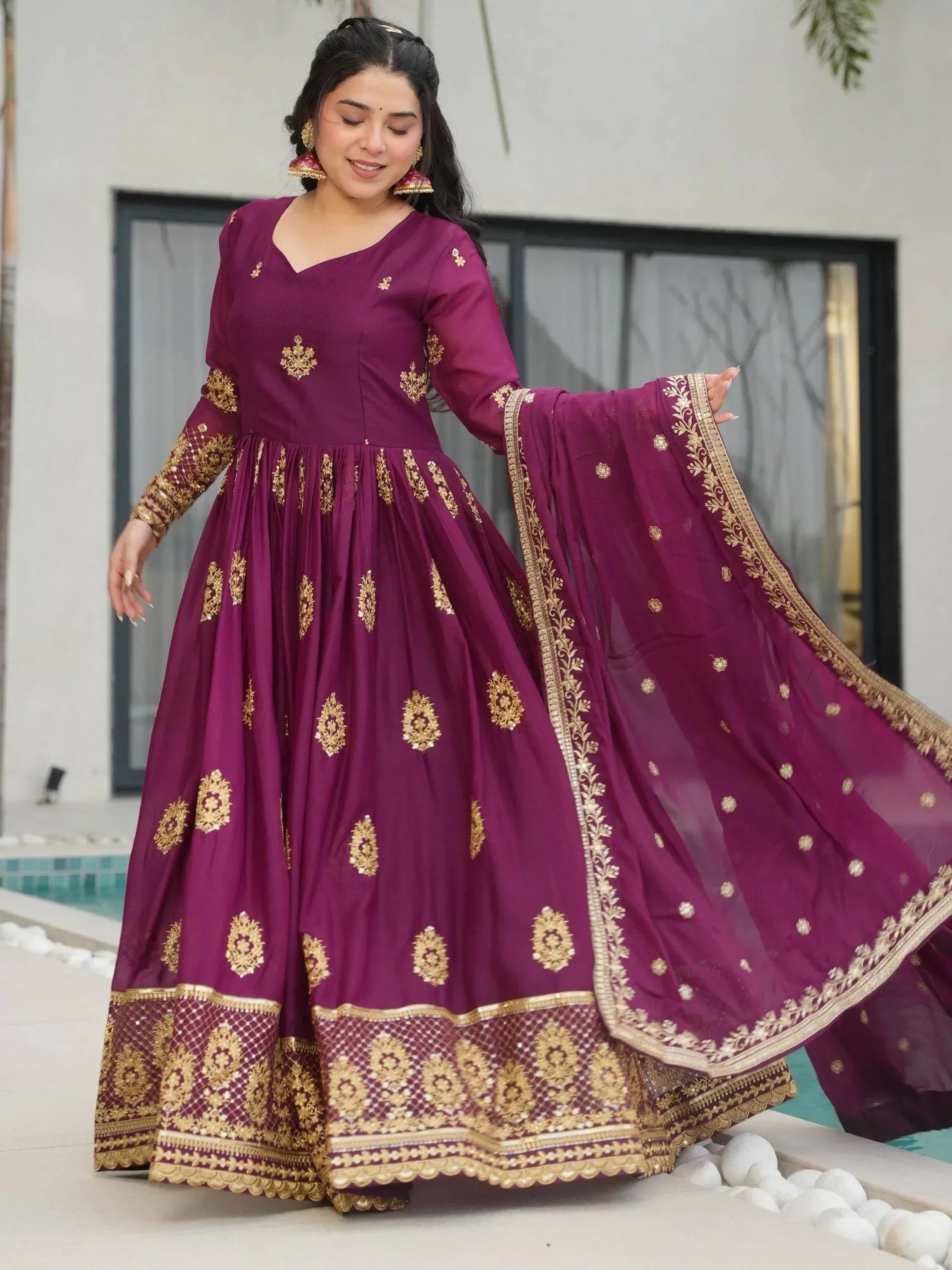 Purple ethnic anarkali with gold embroidery, perfect for Indian weddings or festive occasions