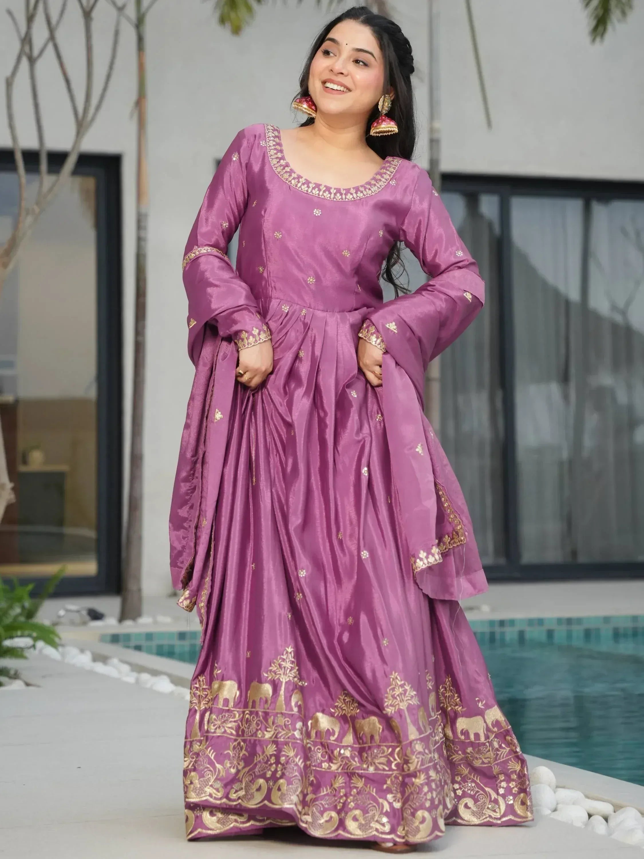 Purple Indian ethnic gown with gold elephant print, perfect for festive occasions and weddings.