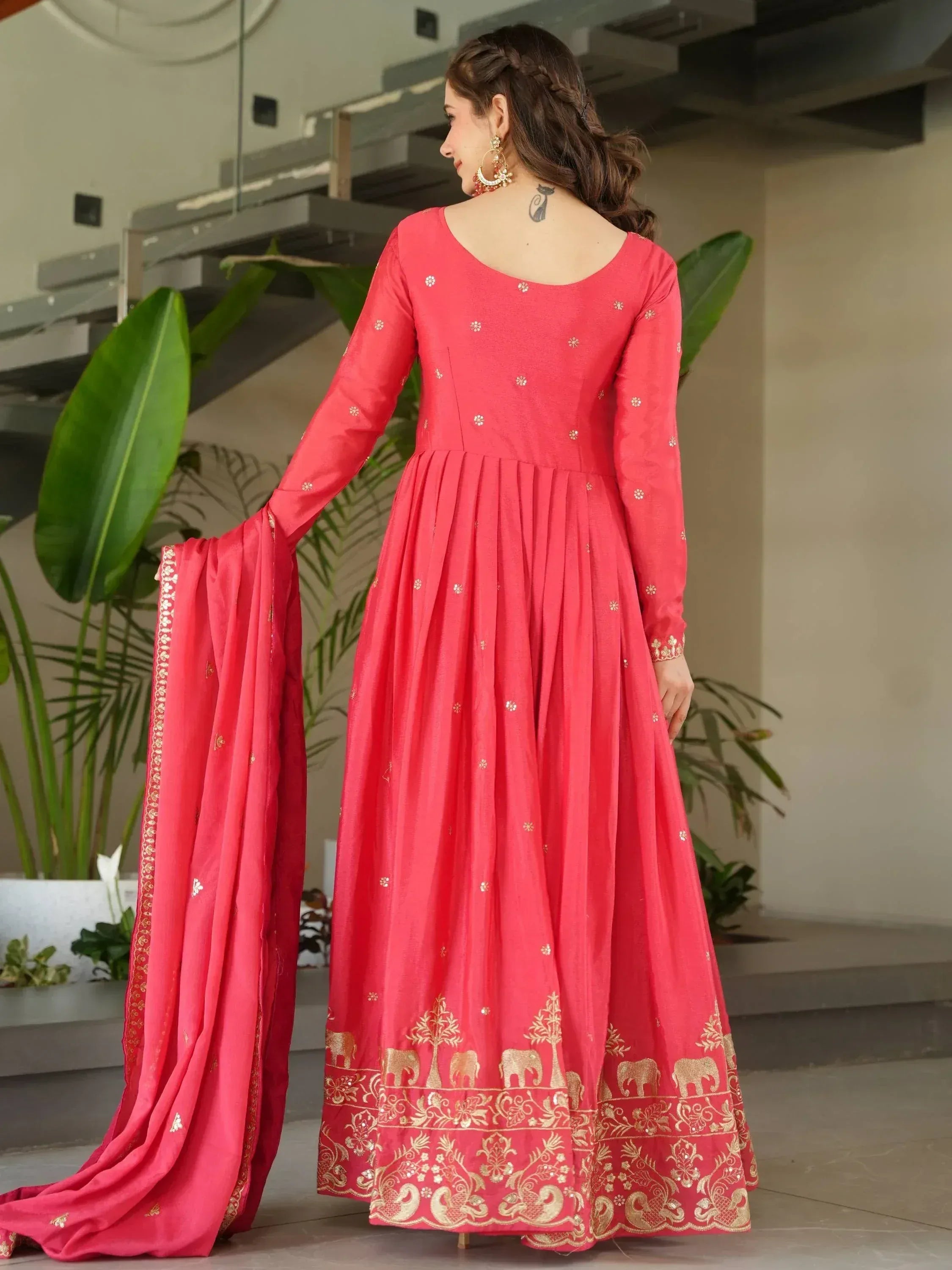 Red ethnic anarkali with gold elephant print and matching dupatta, perfect for Indian weddings or festivals
