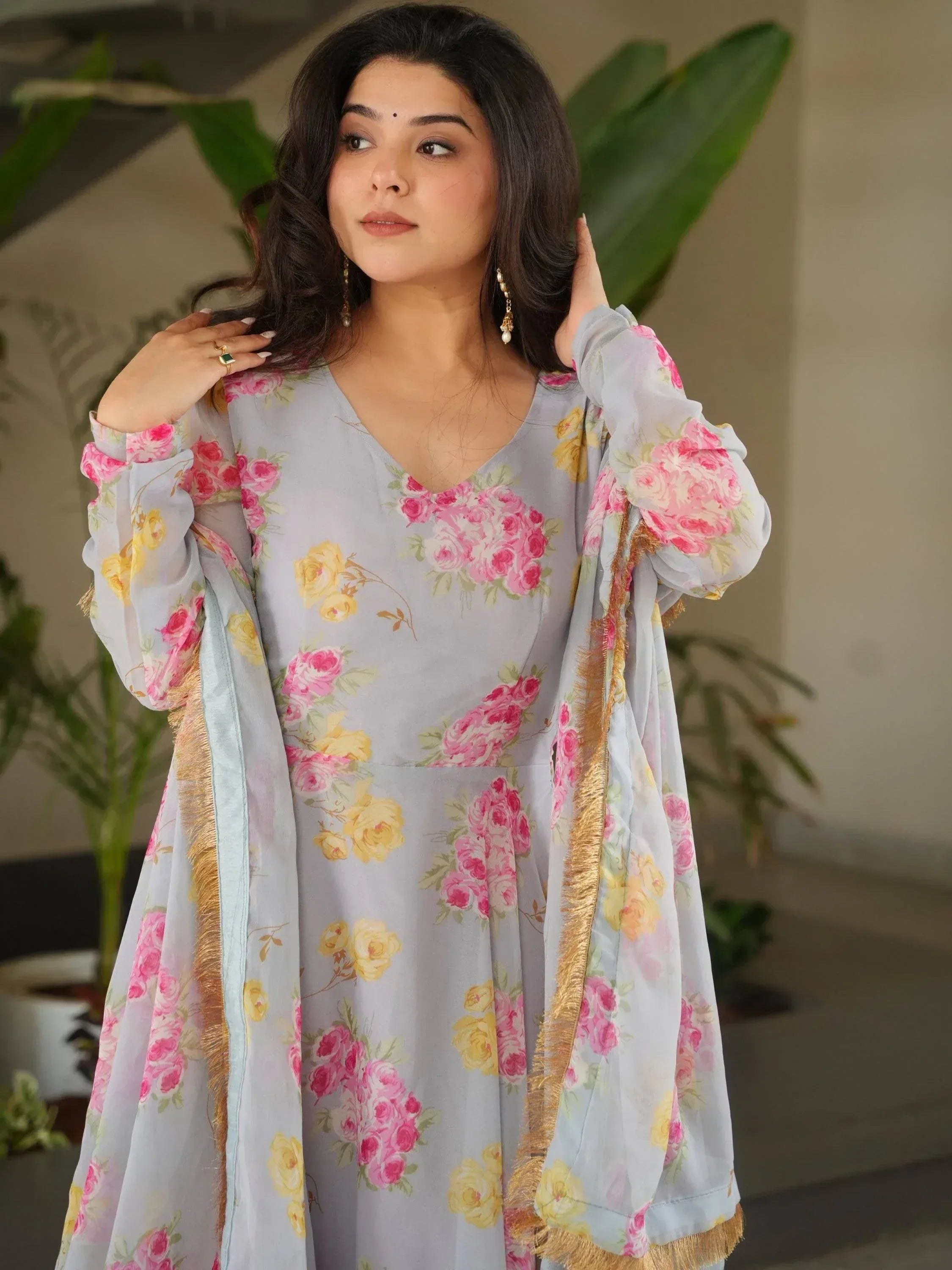 Floral print ethnic gown with gold trim, perfect for Indian occasions and festive wear.