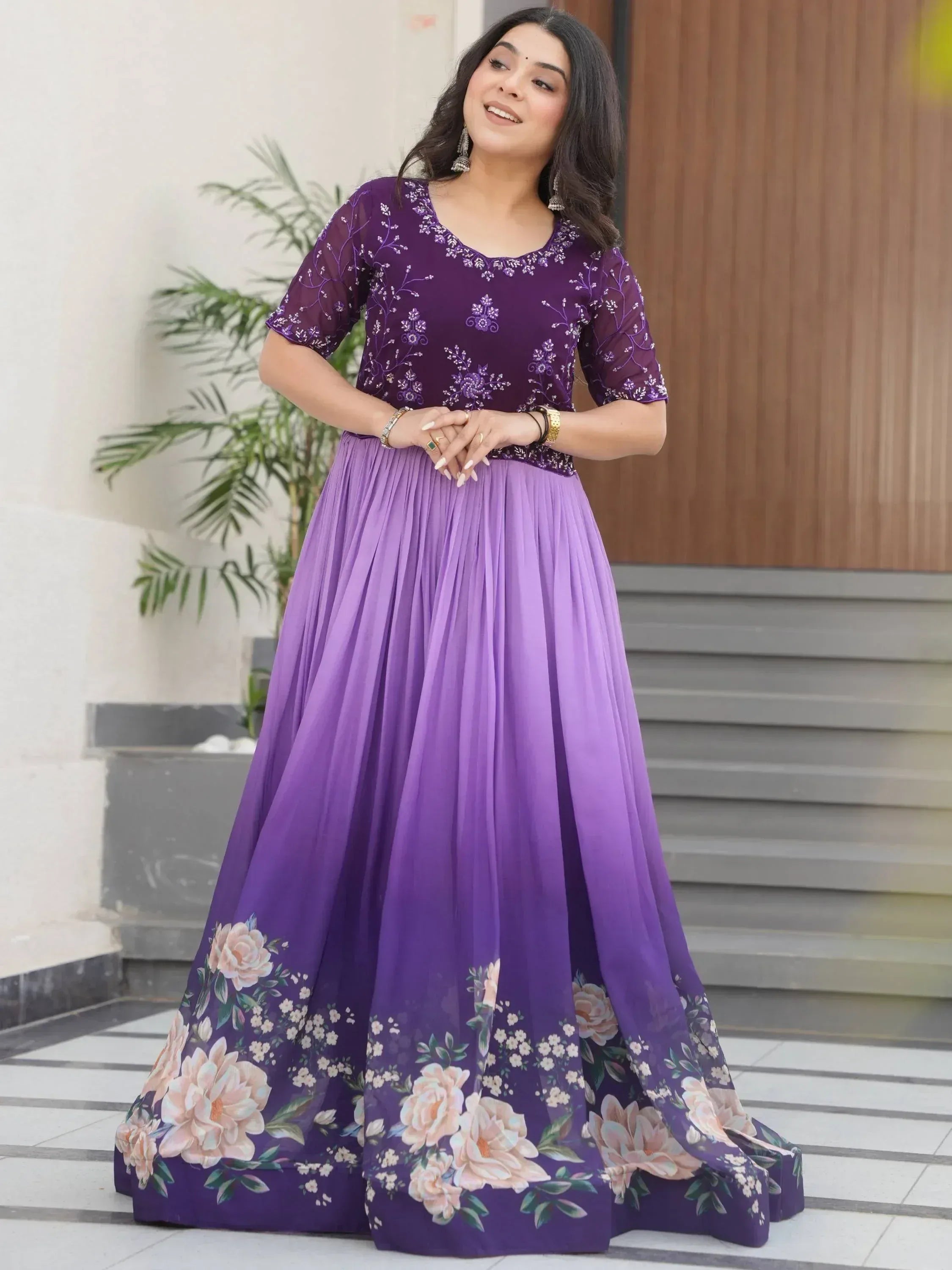 Purple floral embroidered ethnic gown with pleated skirt, perfect for Indian occasions