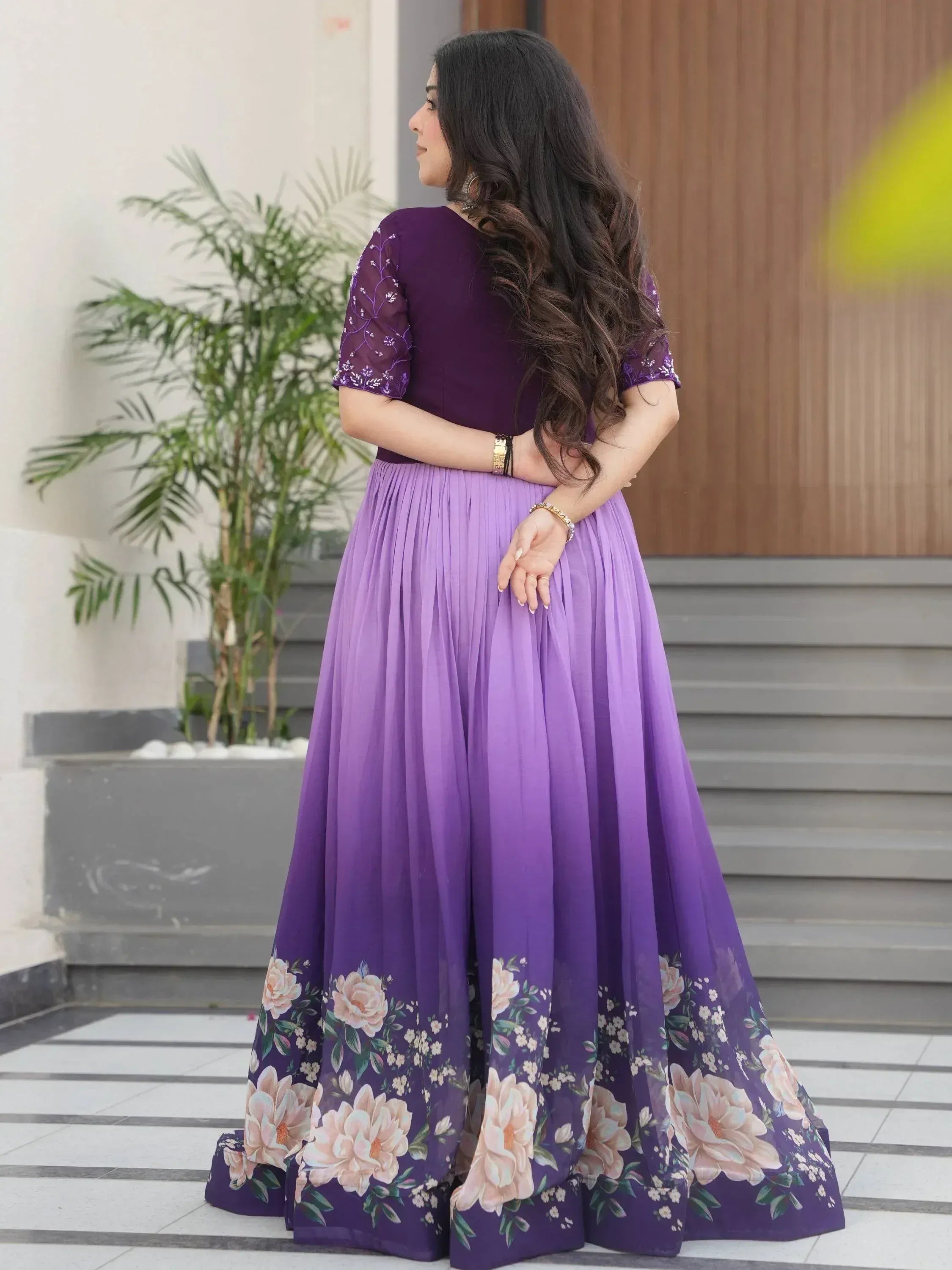 Purple floral ethnic gown with embroidered sleeves, perfect for Indian occasions