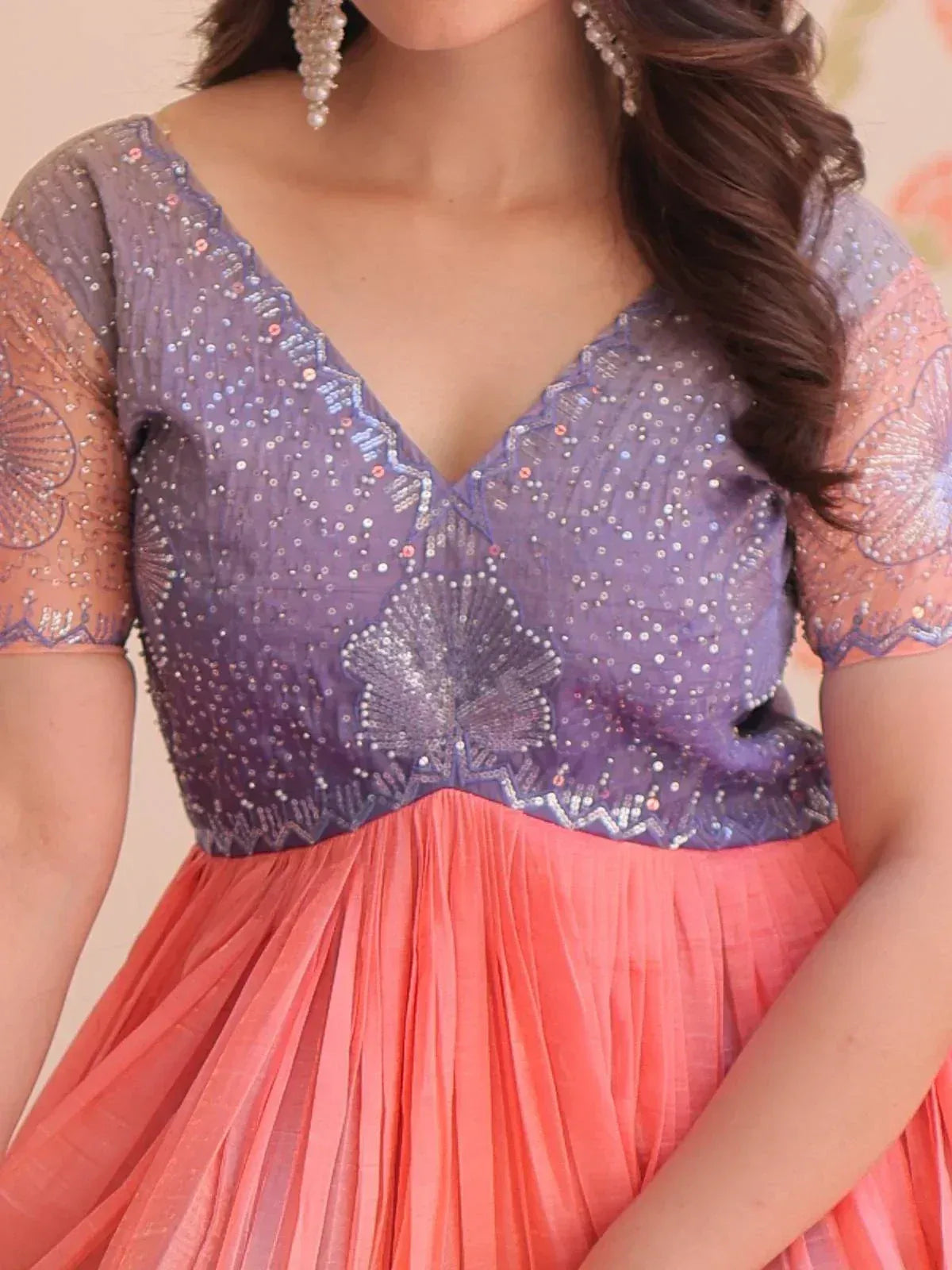 Purple and coral ethnic gown with sequin embroidery and pleated skirt, perfect for Indian occasions