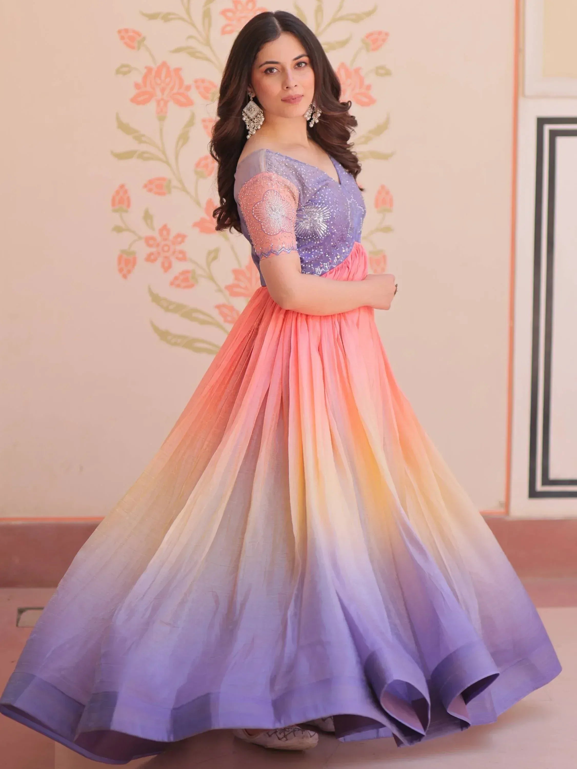 Woman in purple and pink ombre ethnic gown with sequin top, perfect for Indian weddings and parties