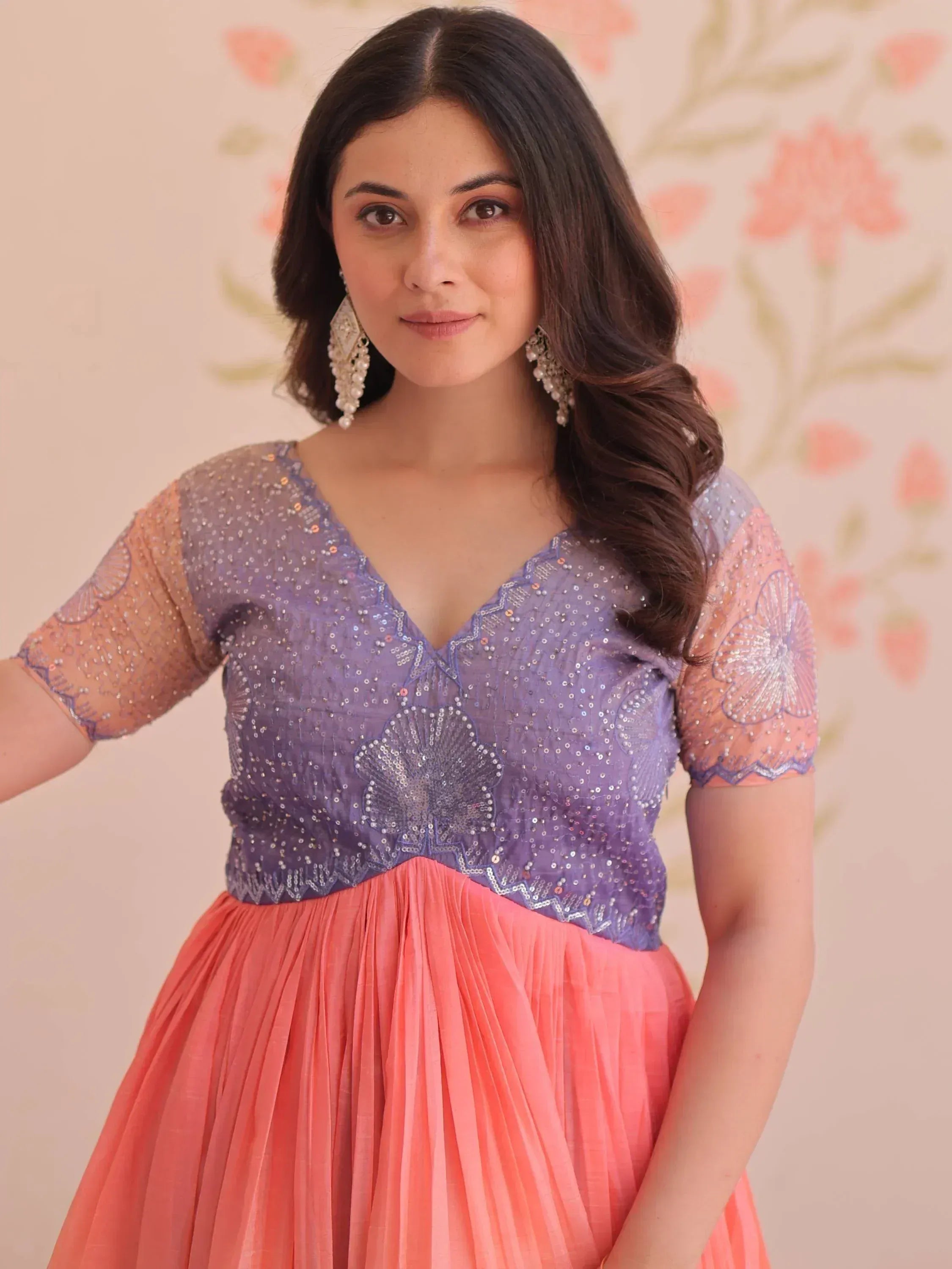 Purple and coral ethnic gown with sequin embroidery and sheer sleeves, perfect for Indian celebrations