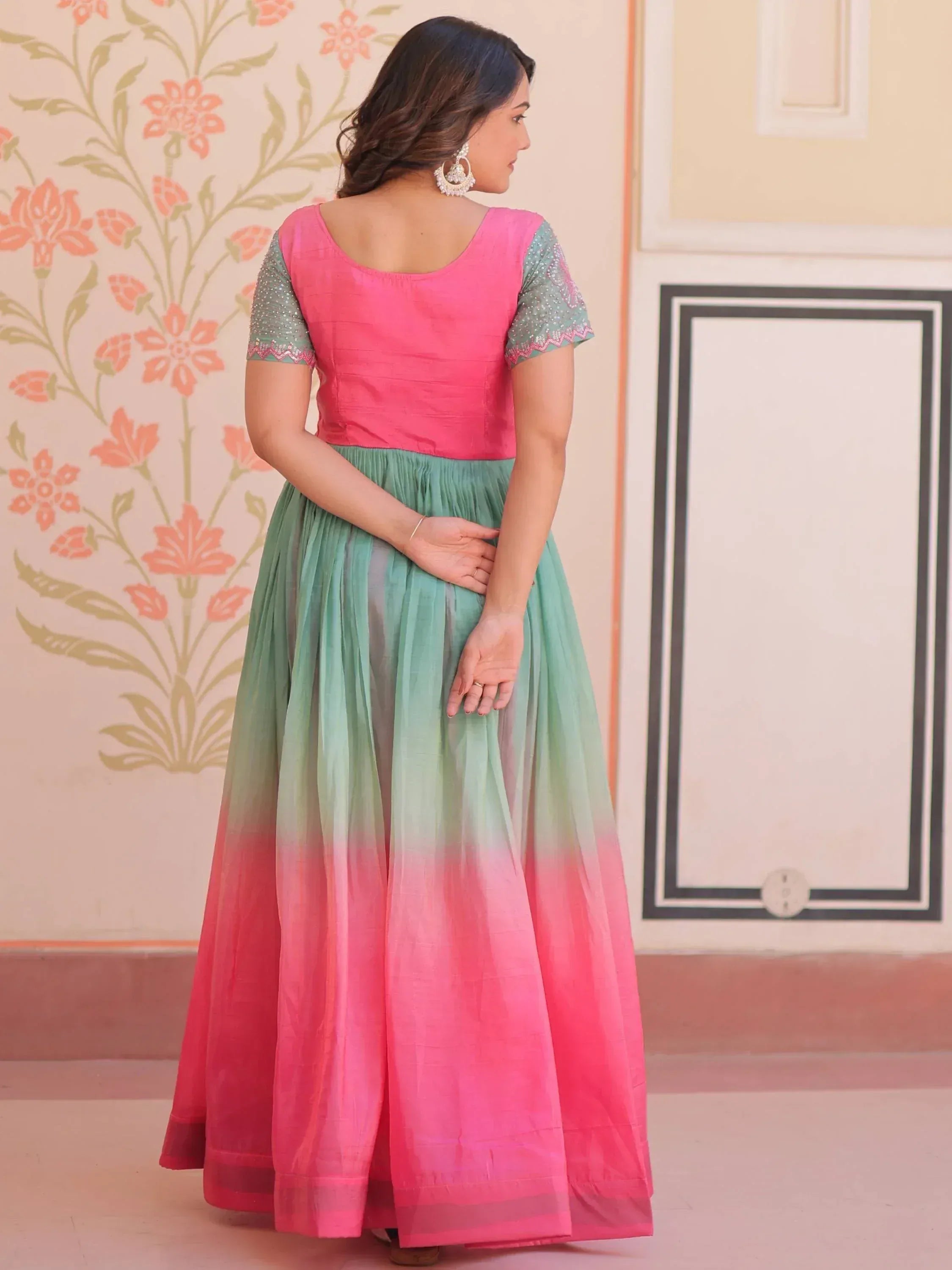 Pink and mint ombre ethnic gown with embroidered sleeves, perfect for Indian festive occasions.