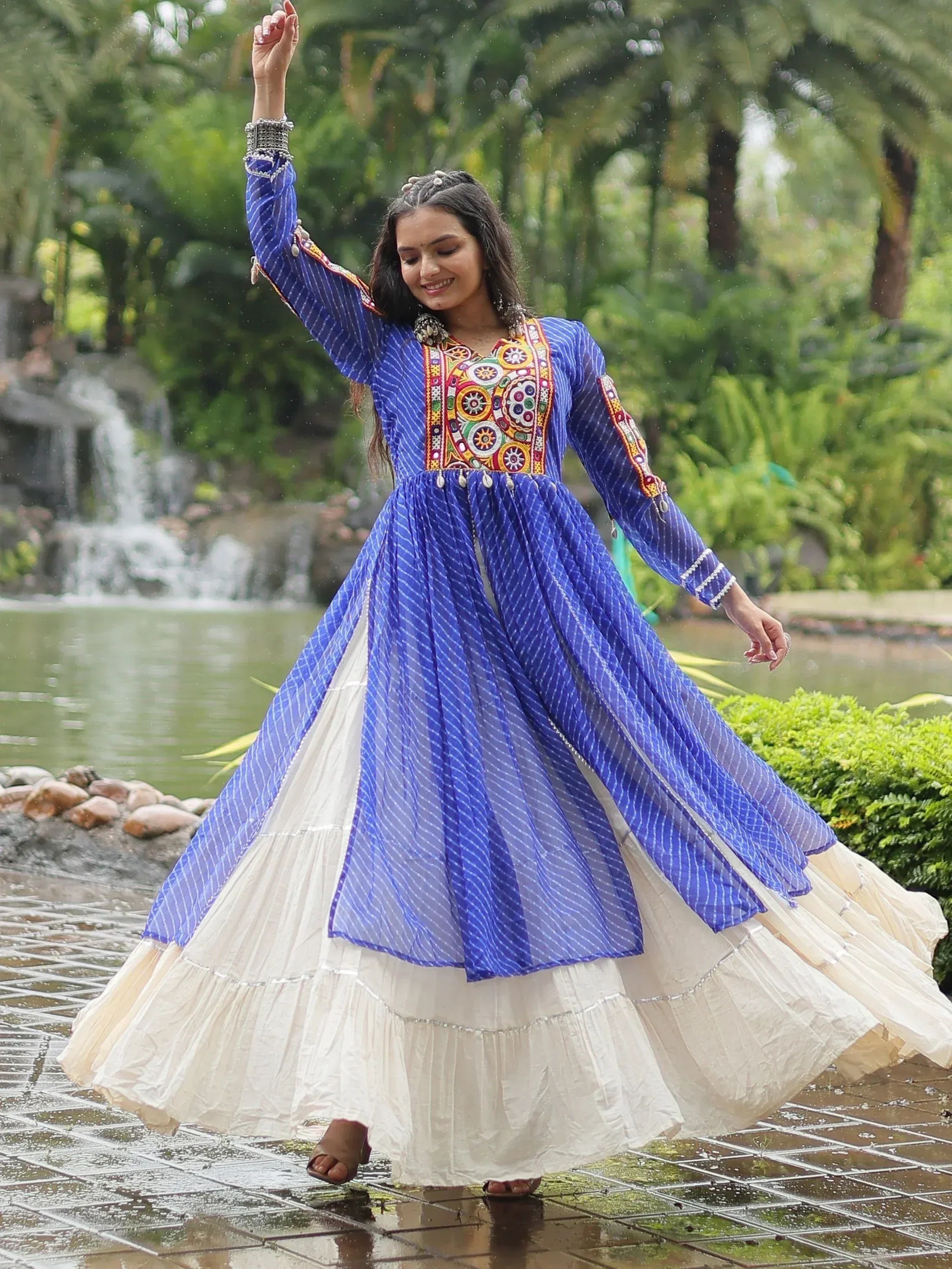 Blue and white ethnic gown with colorful embroidery, perfect for festive occasions