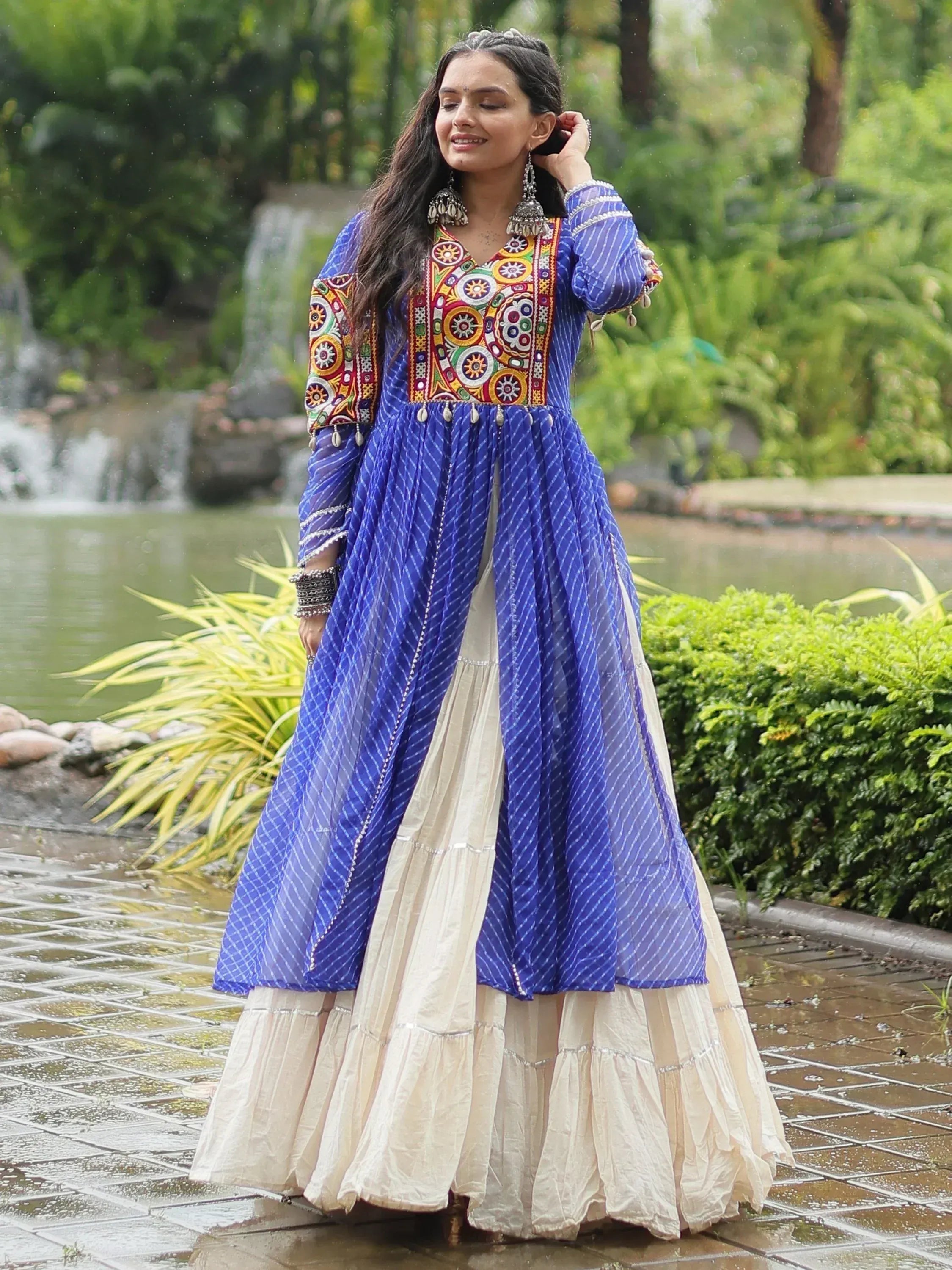 Blue embroidered ethnic gown with cream skirt, perfect for Indian festive occasions