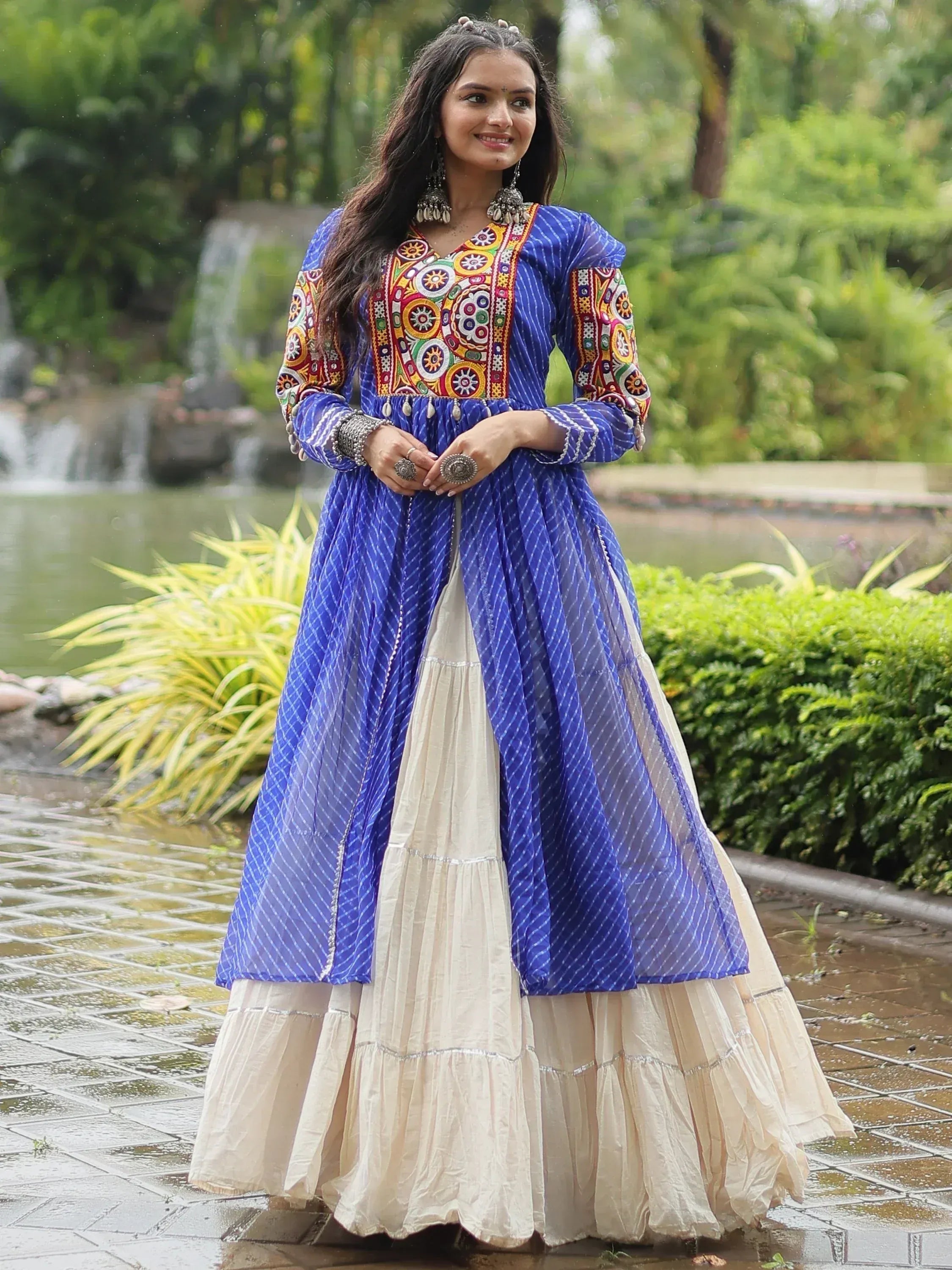Blue and cream ethnic gown with colorful embroidery, perfect for Indian occasions and festive wear.