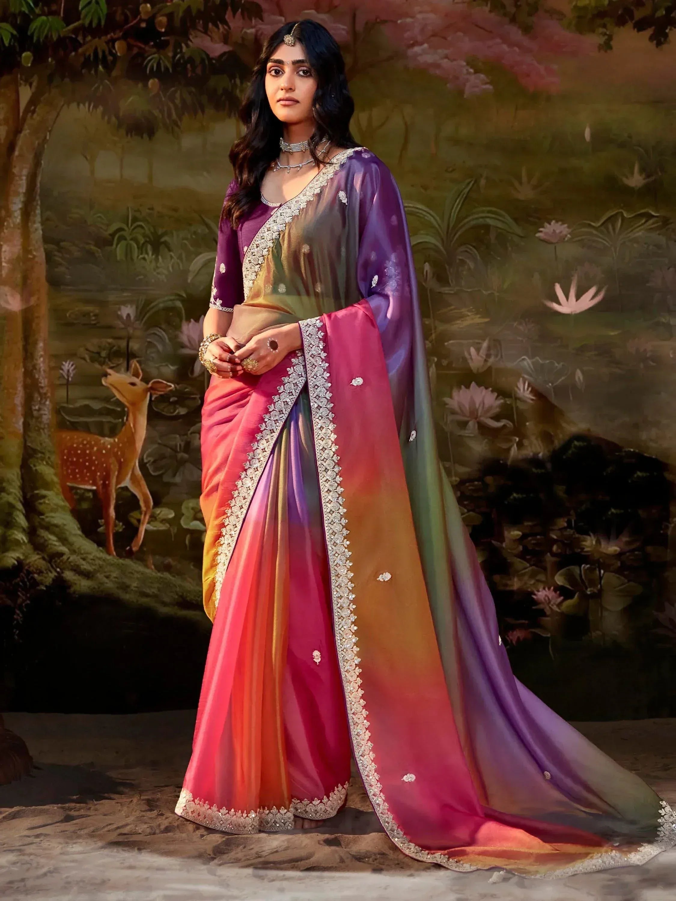 Woman in vibrant ombre saree with silver embroidery, perfect for Indian ethnic wear occasions