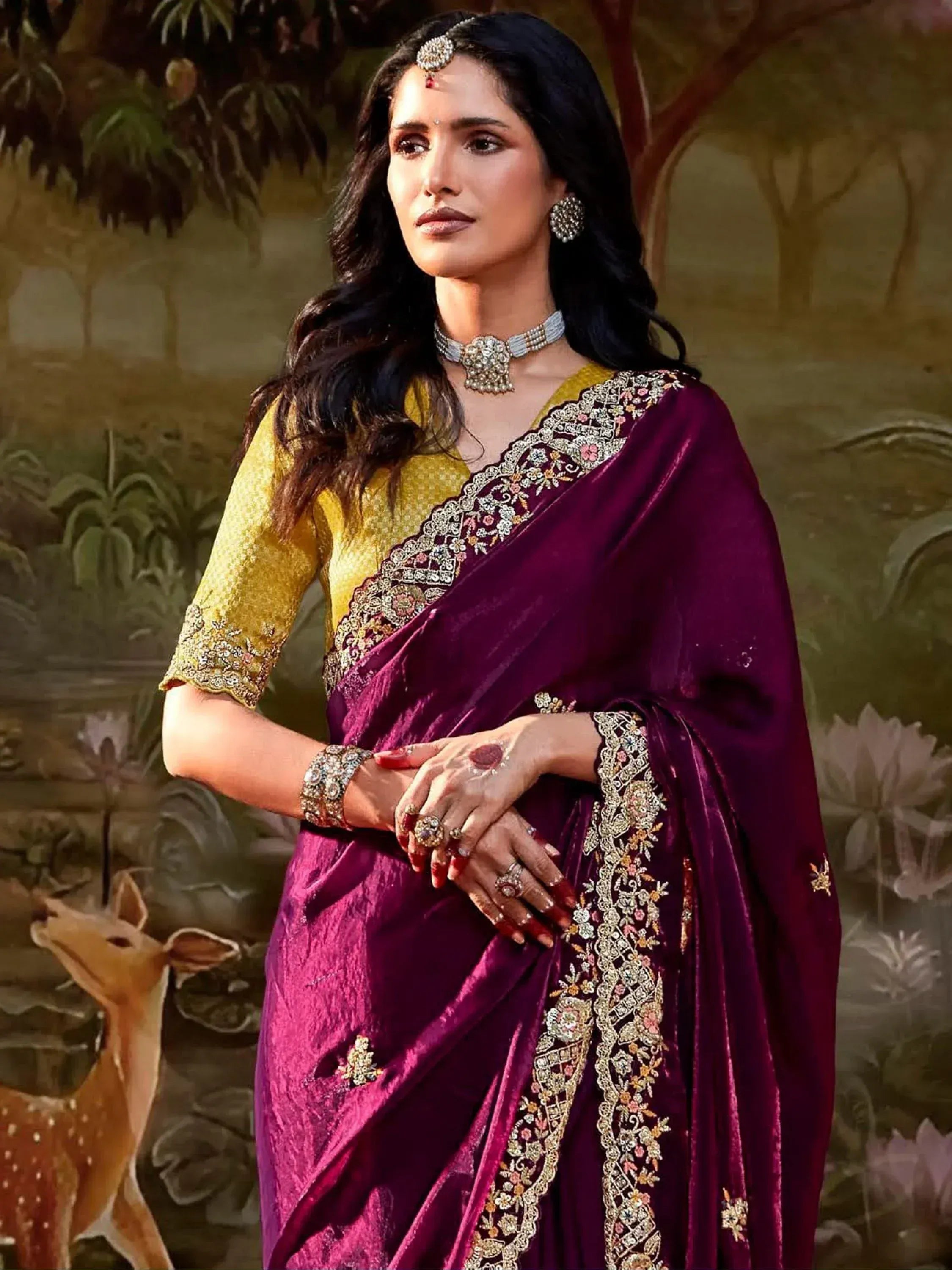 Elegant purple velvet saree with gold embroidery, paired with yellow blouse, perfect for Indian ethnic occasions.