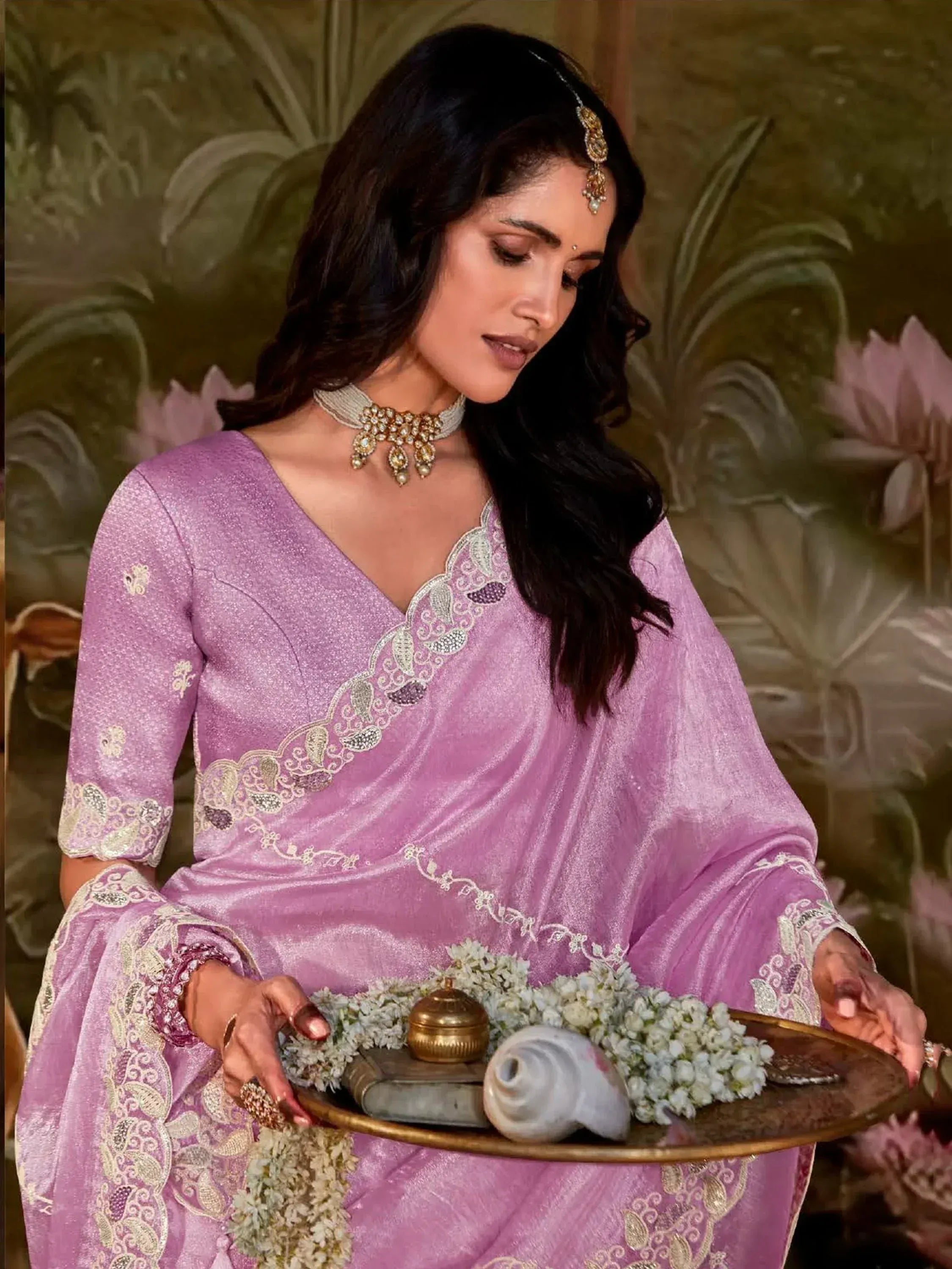 Elegant purple ethnic gown with gold embroidery, perfect for Indian weddings and festive occasions.