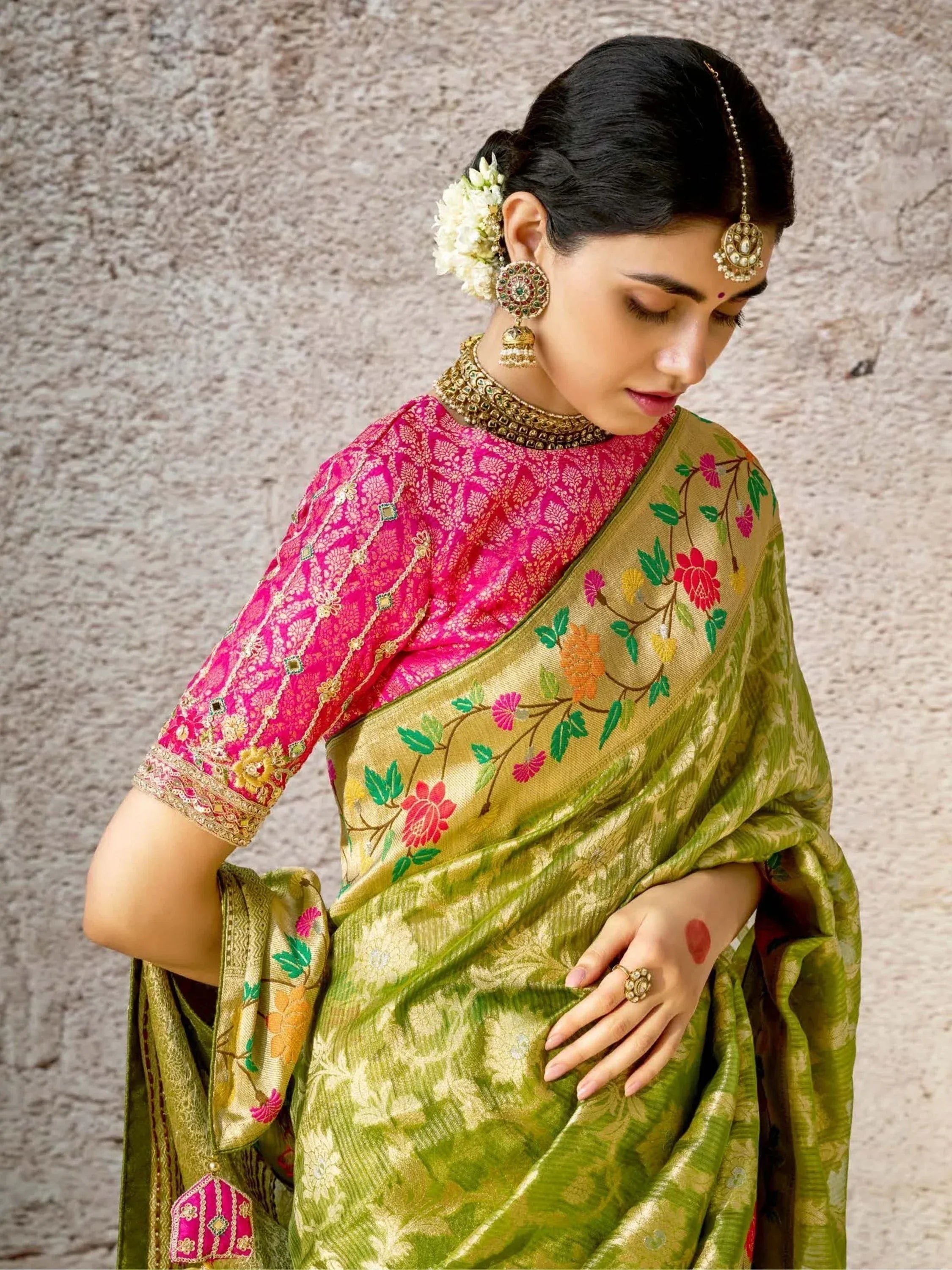 Woman in green floral saree with pink embroidered blouse, traditional Indian ethnic wear