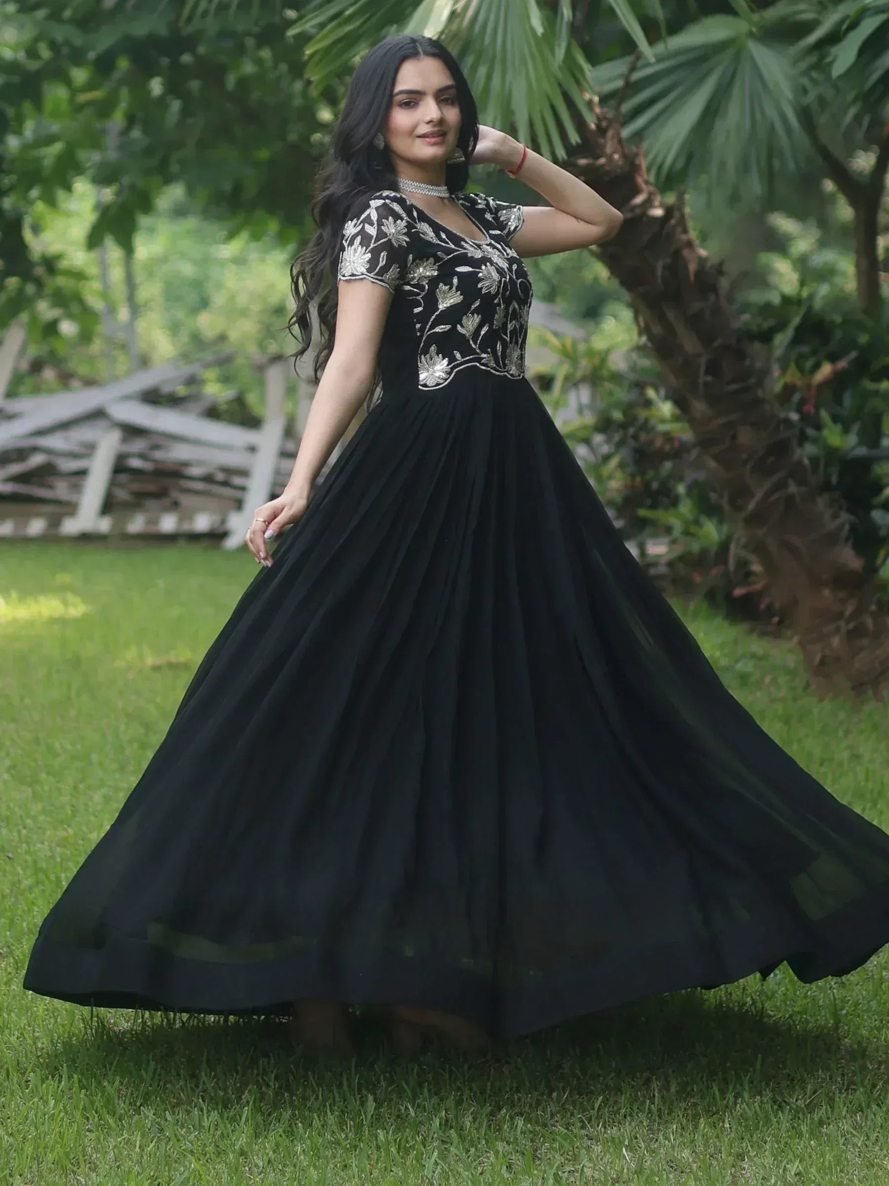 Black ethnic gown with silver floral embroidery, perfect for Indian occasions and events.