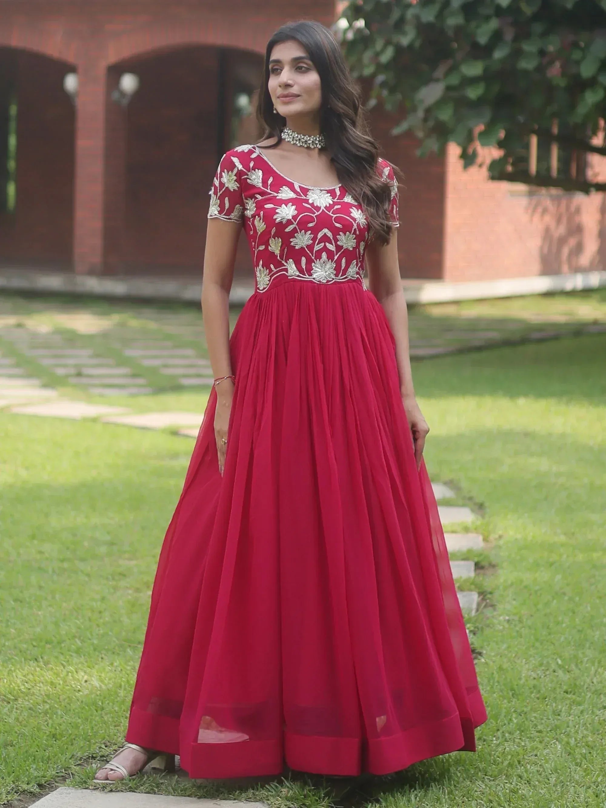 Red ethnic gown with floral embroidery, perfect for Indian weddings and festive occasions