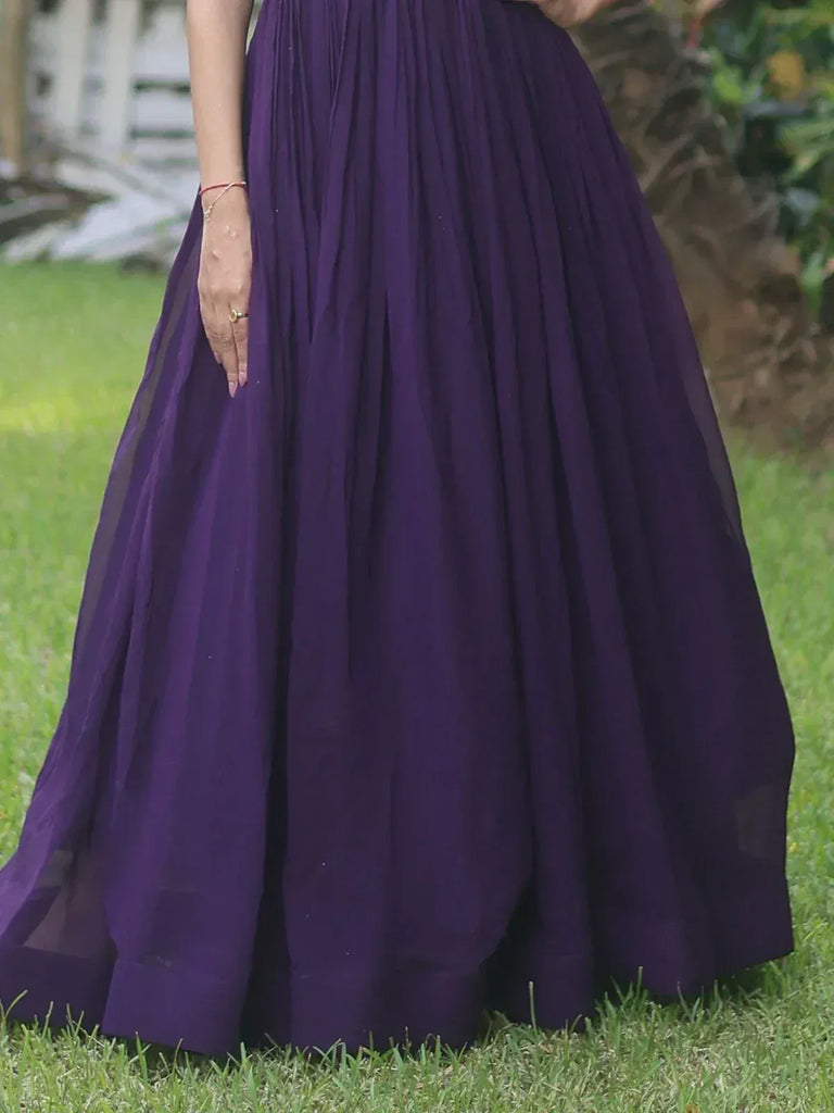 Purple ethnic gown with pleated skirt, perfect for Indian occasions and festive wear.