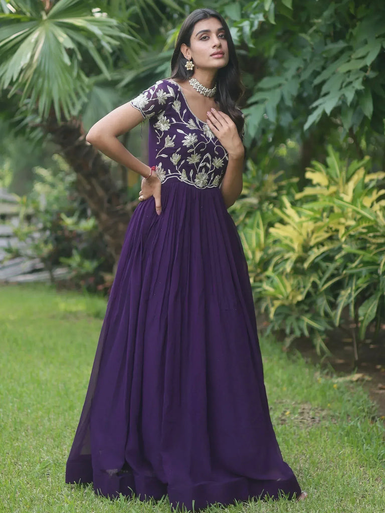 Purple ethnic gown with gold floral embroidery, perfect for Indian occasions and parties
