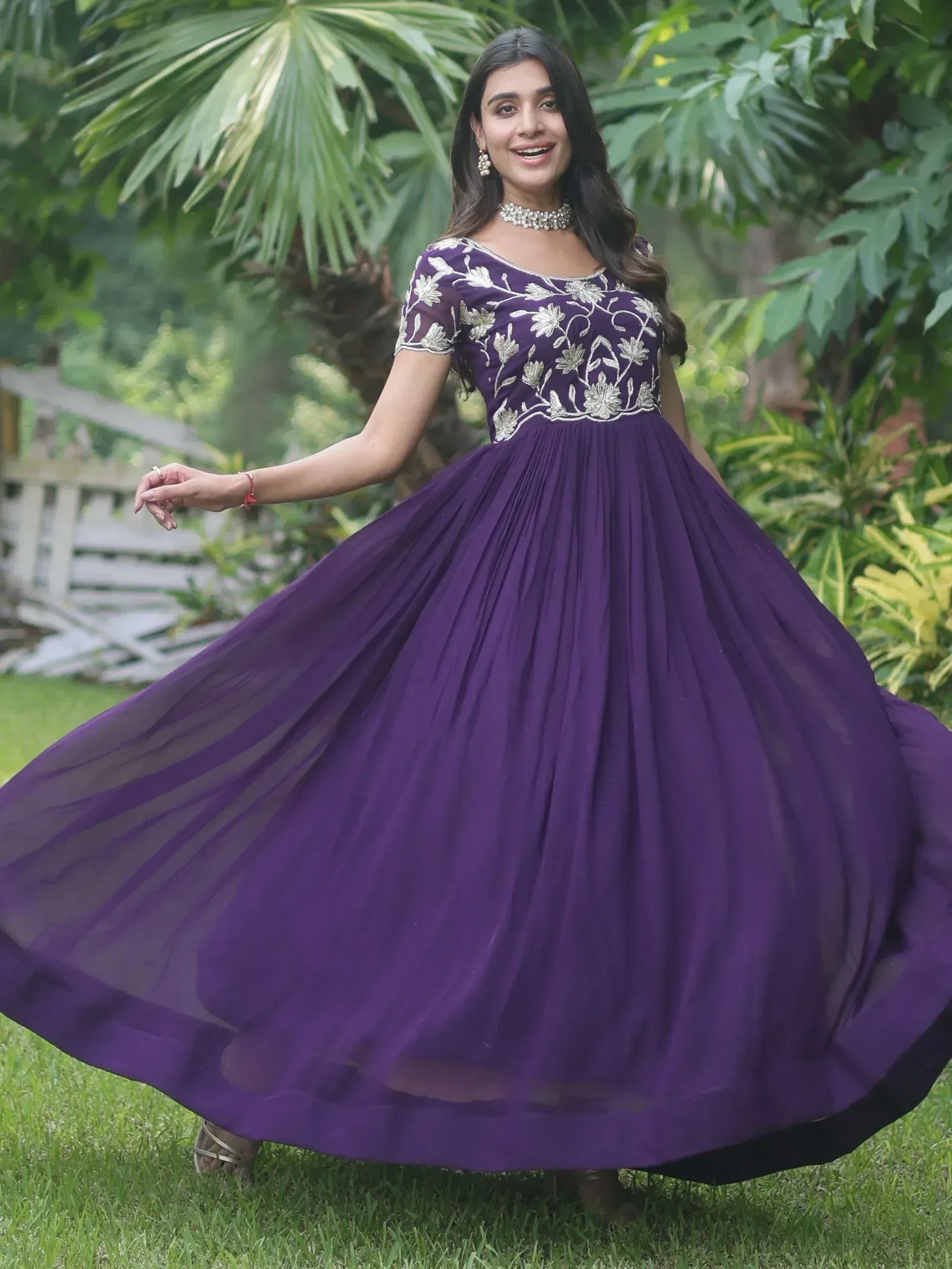 Purple ethnic gown with silver floral embroidery, perfect for Indian occasions and festive wear.