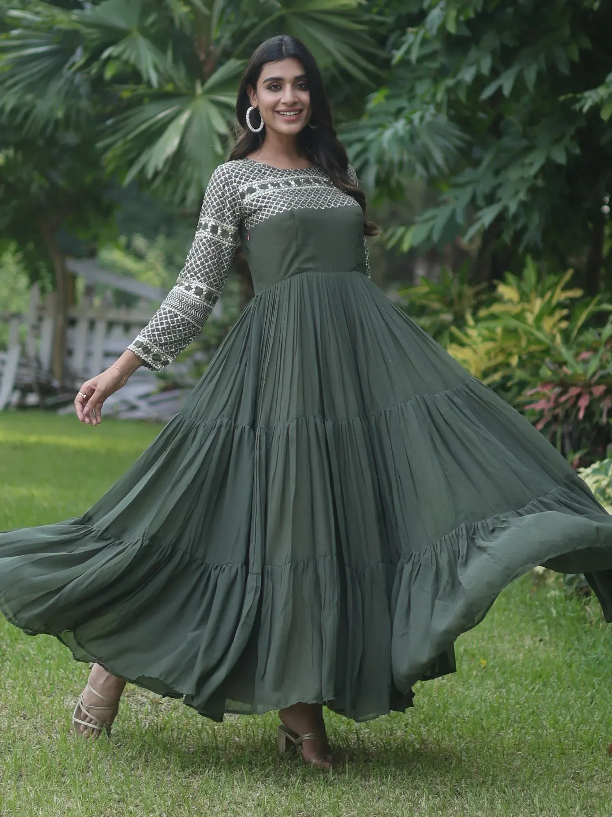 Olive green ethnic gown with embroidered sleeves, perfect for Indian festive occasions and parties.