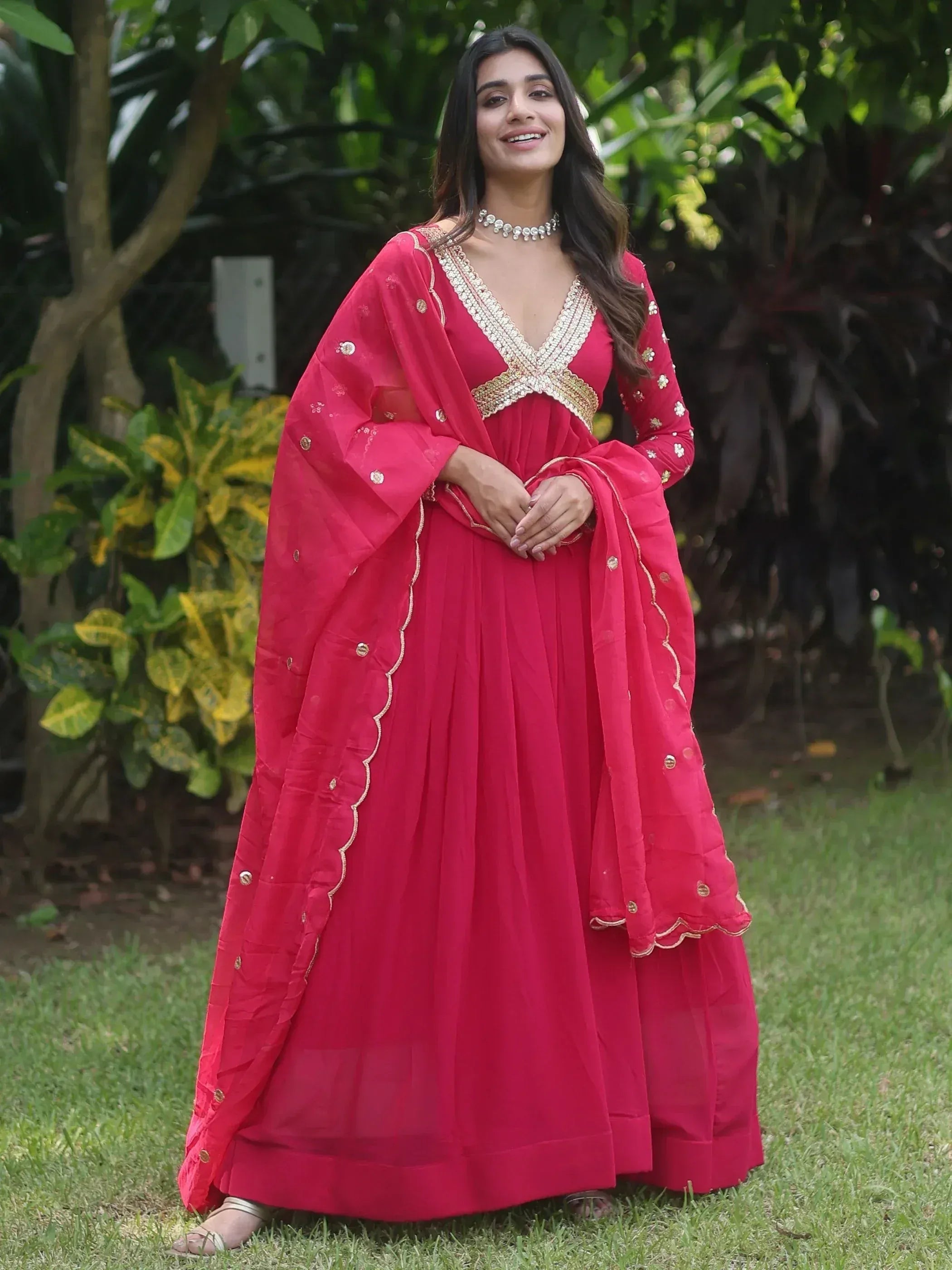 Red ethnic gown with gold embroidery, perfect for Indian occasions and festive wear