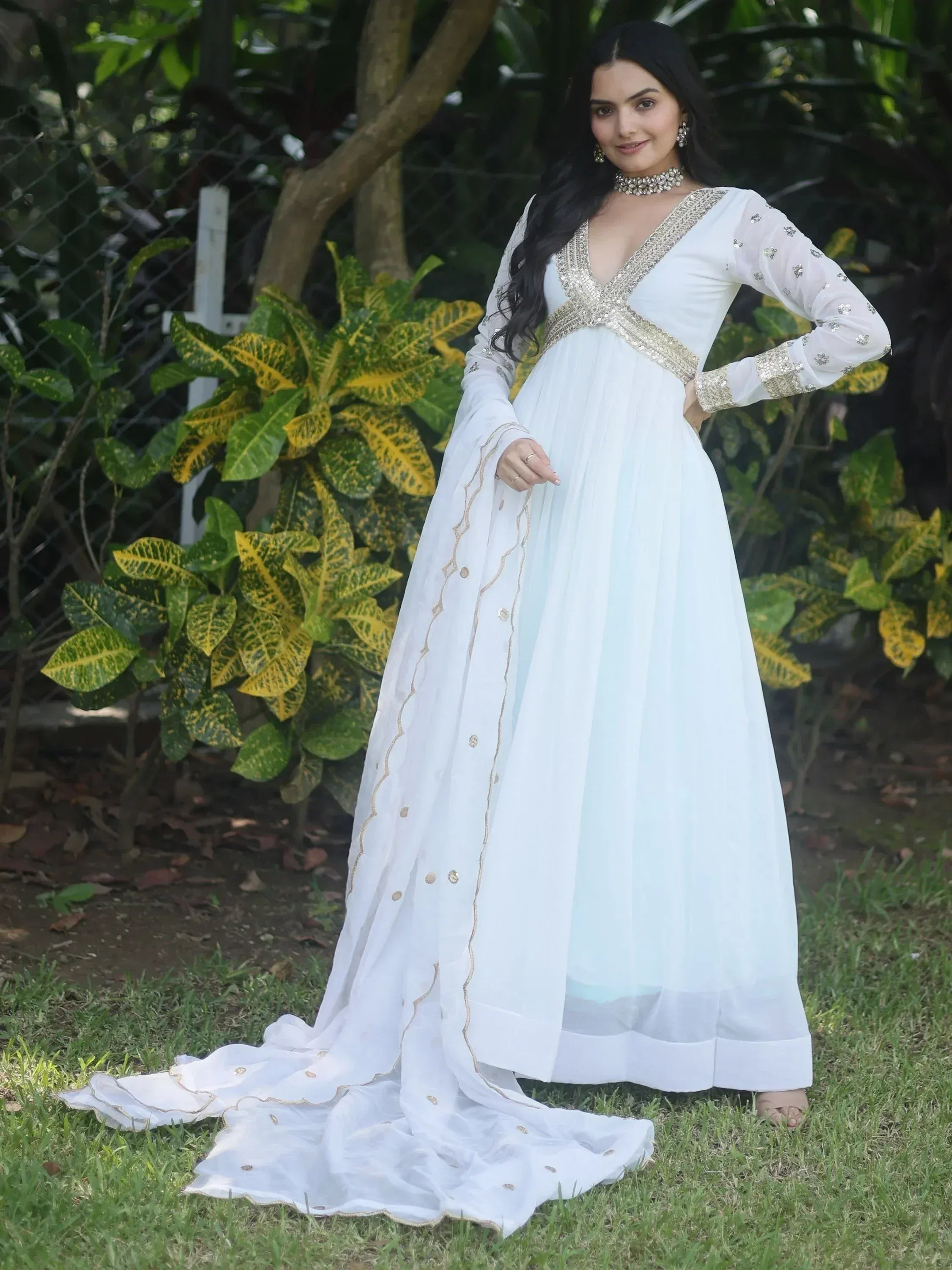 White ethnic gown with gold embroidery, perfect for Indian weddings and festive occasions