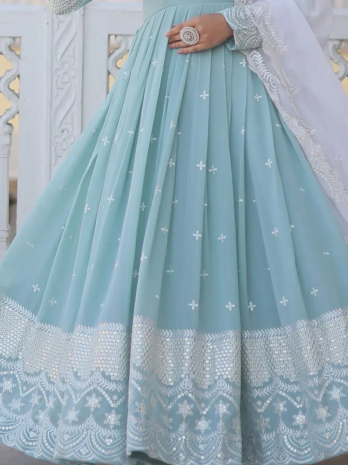 Mint green embroidered lehenga with silver mirror work and floral motifs, perfect for Indian ethnic wear