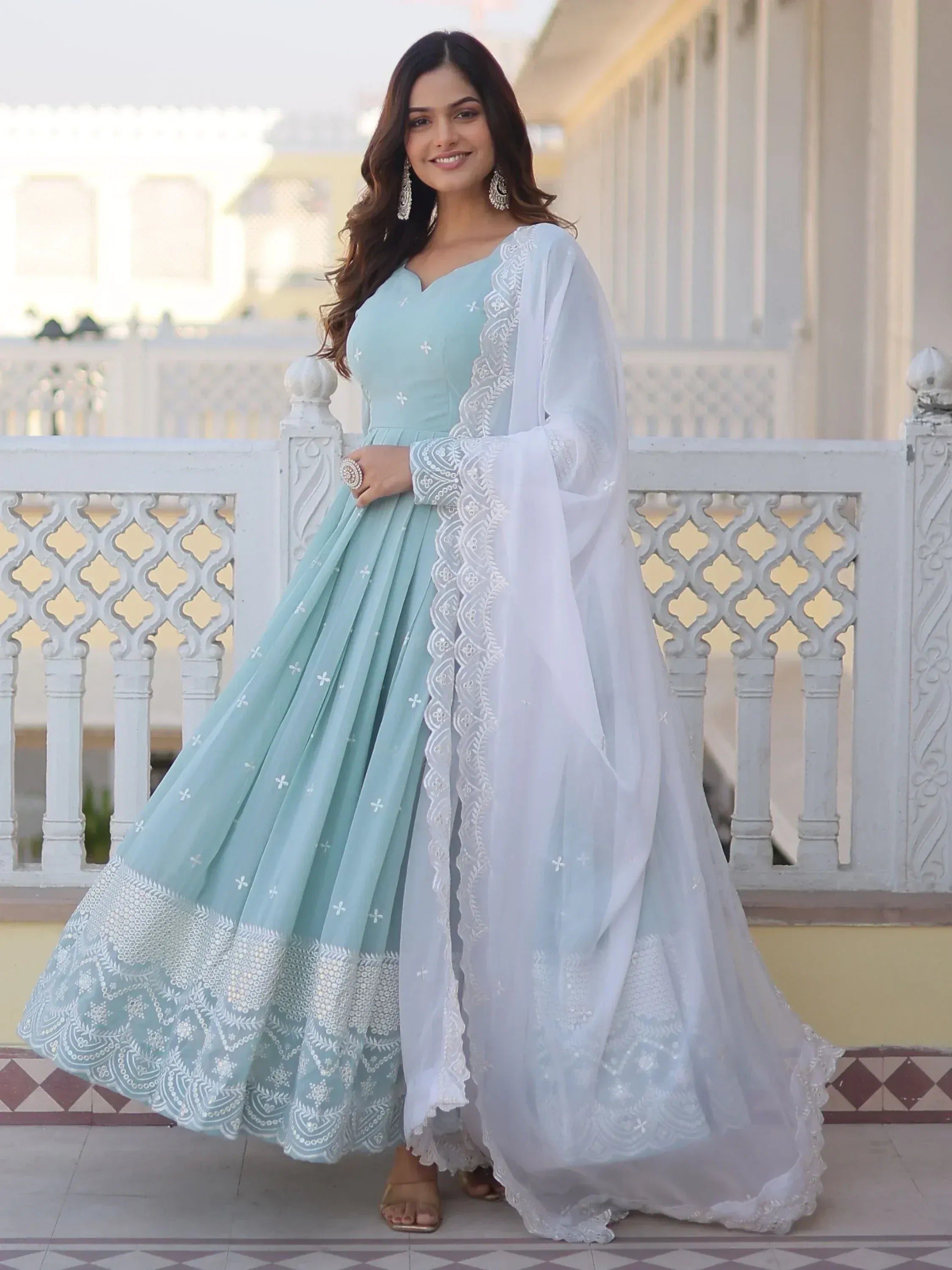 Mint blue embroidered lehenga choli with white dupatta, perfect for Indian ethnic wear occasions