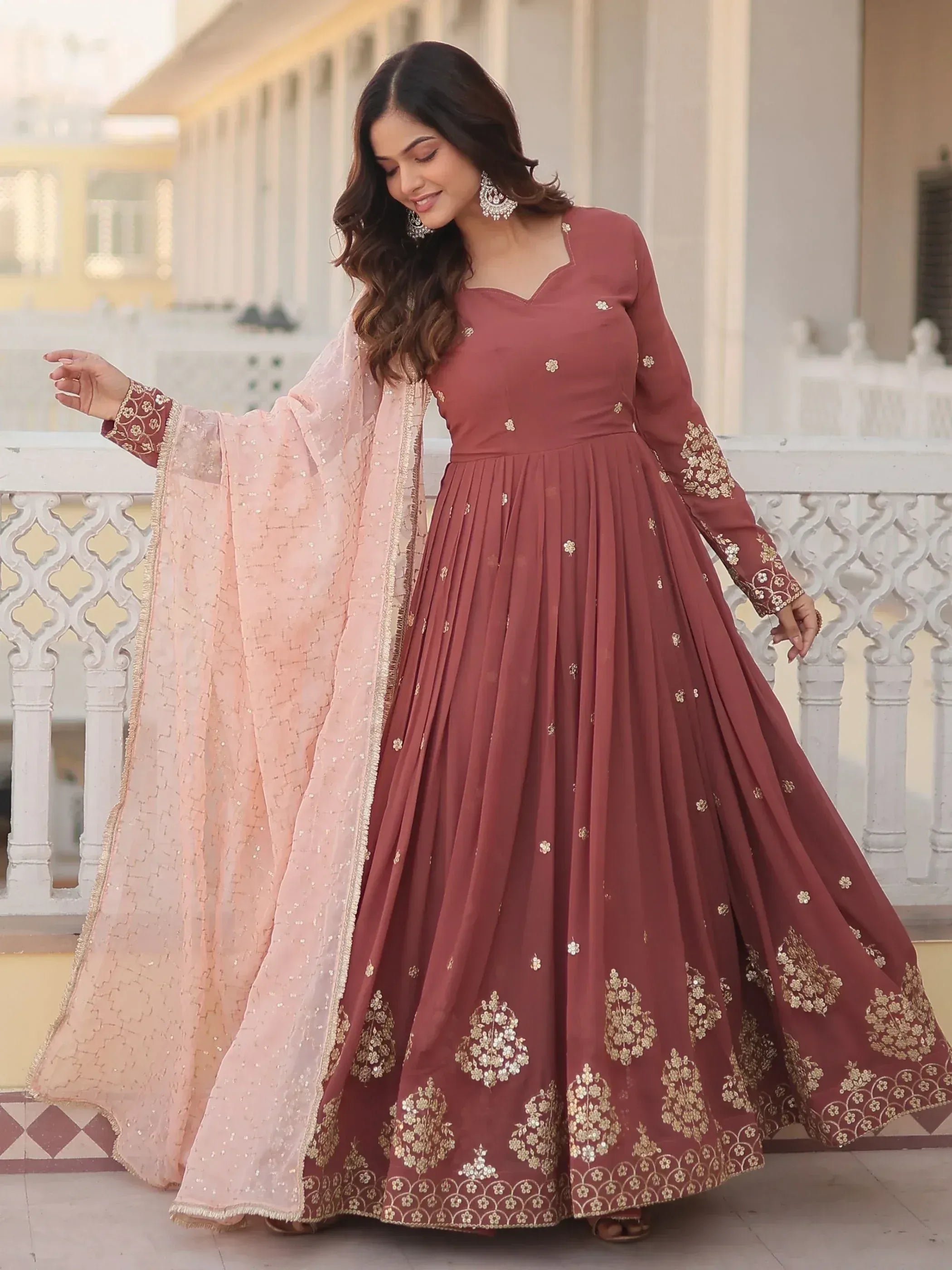 Elegant maroon anarkali with gold embroidery and pink dupatta, perfect for Indian ethnic occasions