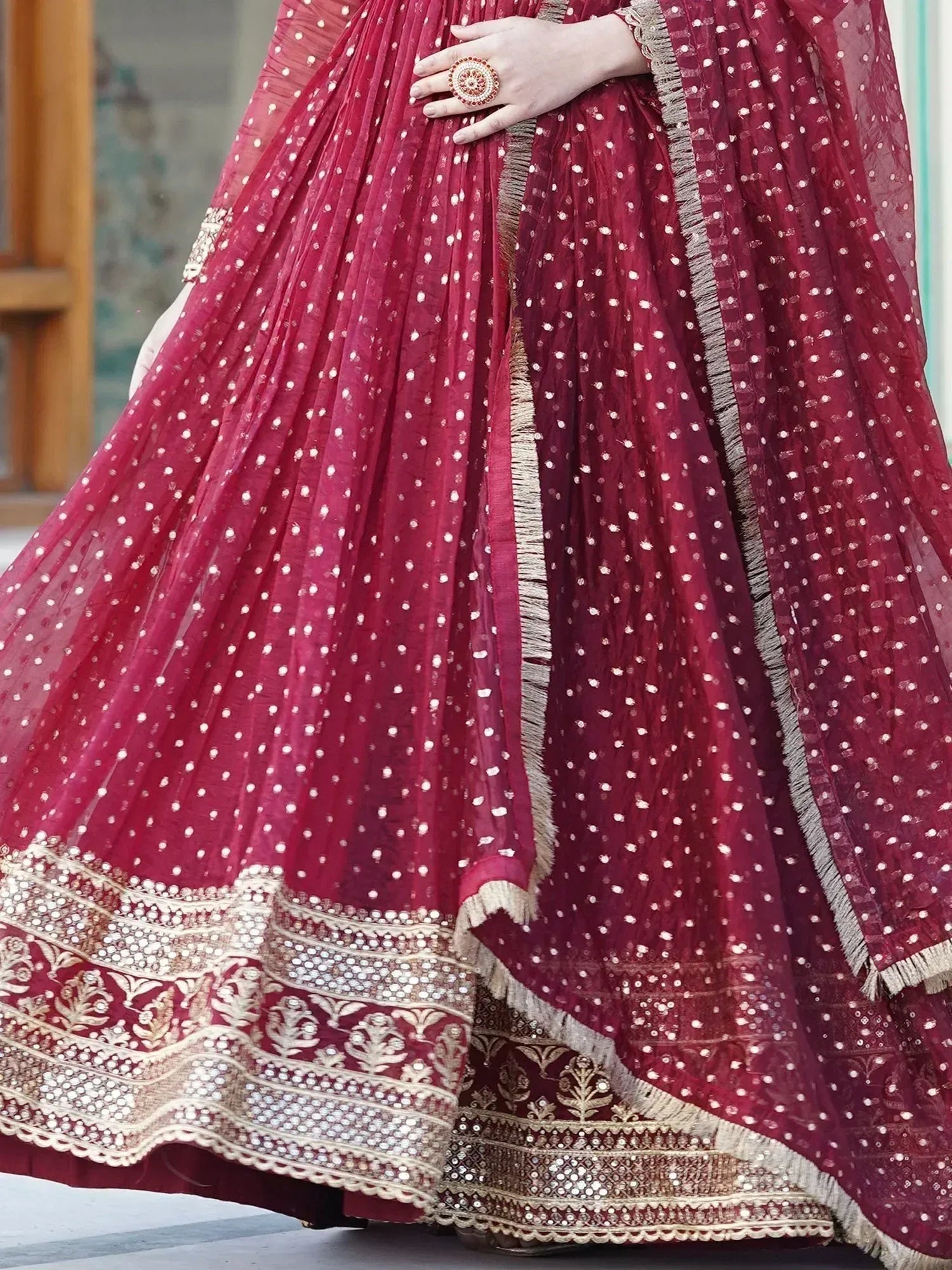 Maroon lehenga choli with white polka dots and gold embroidery, perfect for Indian ethnic wear
