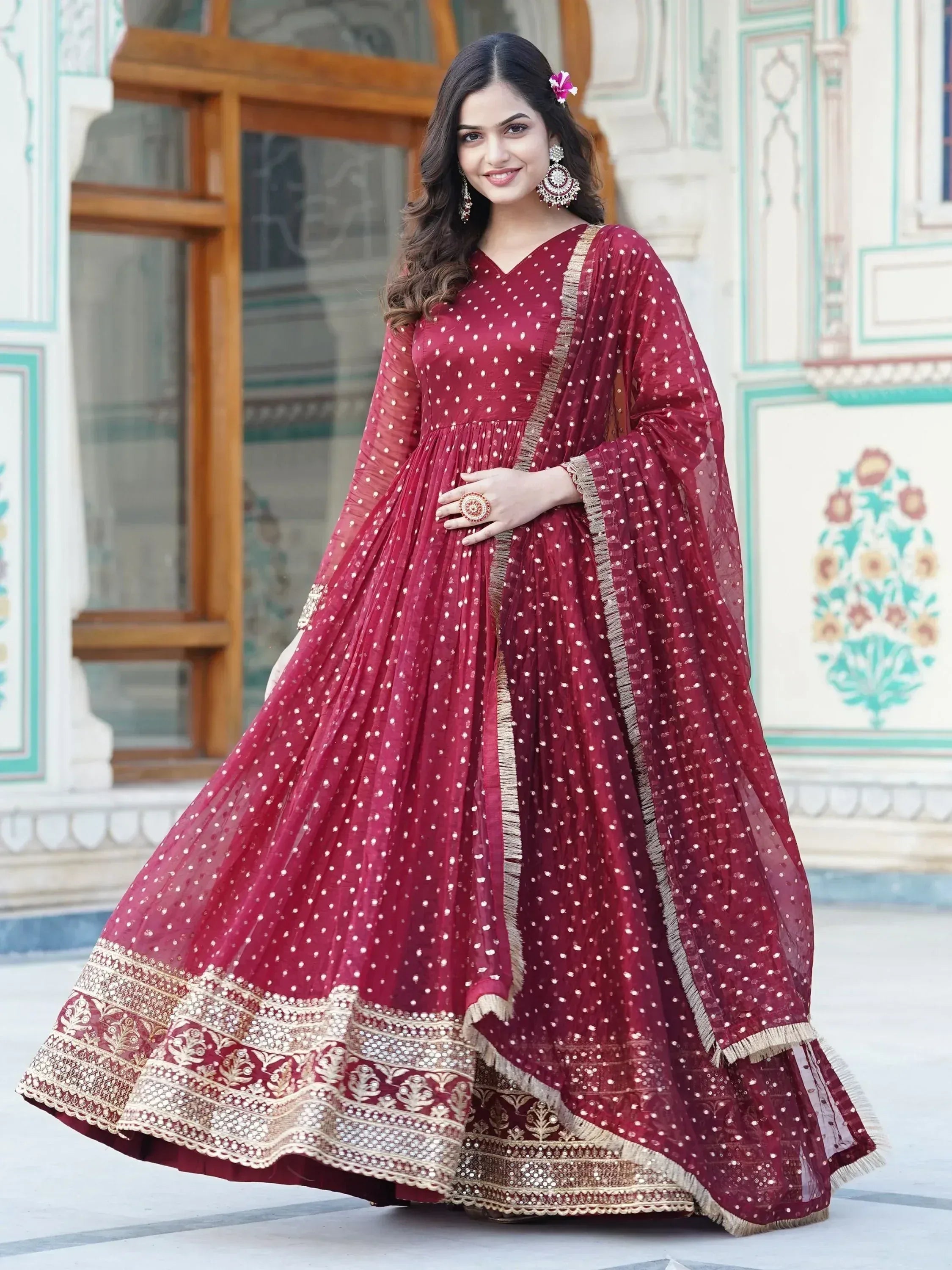 Maroon ethnic anarkali gown with gold embroidery and polka dots, perfect for Indian weddings and festive occasions.